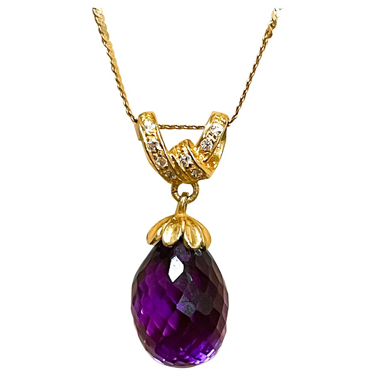 Approximately 12 Ct Checkerboard Amethyst Drop & Diamond Pendent/Necklace 14 Karat Yellow Gold Chain
One Large  Drop of natural Amethyst which has checkerboard design and a diamond designed bow and cap on it.
Pendant necklace is a eye-catching