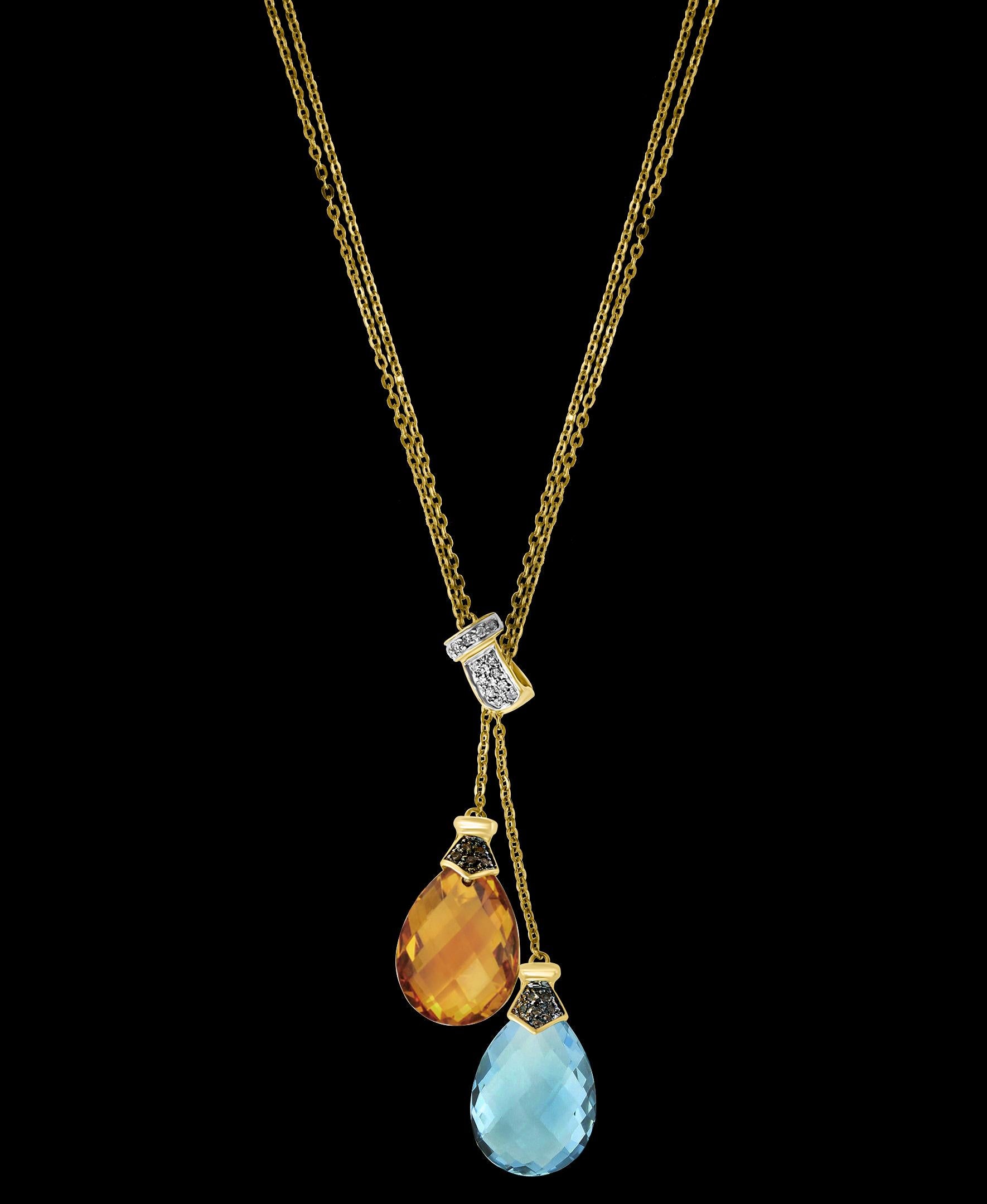 Checkerboard  Citrine & Blue Topaz  Pendent/Necklace 14 Karat Gold Double Chain
Two Drops one  Citrin Drop and one Blue Topaz drop , Both have checkerboard design and a diamond cap on them.
Pendant necklace is a eye-catching pendant necklace . It
