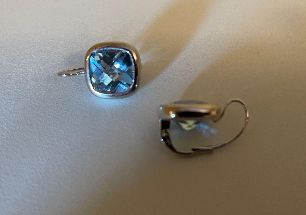 Simply Beautiful! Classic and finely detailed Pair Checkerboard Cushion cut Natural Blue Topaz Gold Vintage Solitaire Earrings. Featuring two securely Hand set round Checkerboard Cushion cut Natural Blue Topaz Gemstones, weighing approx. 7.55 Carat