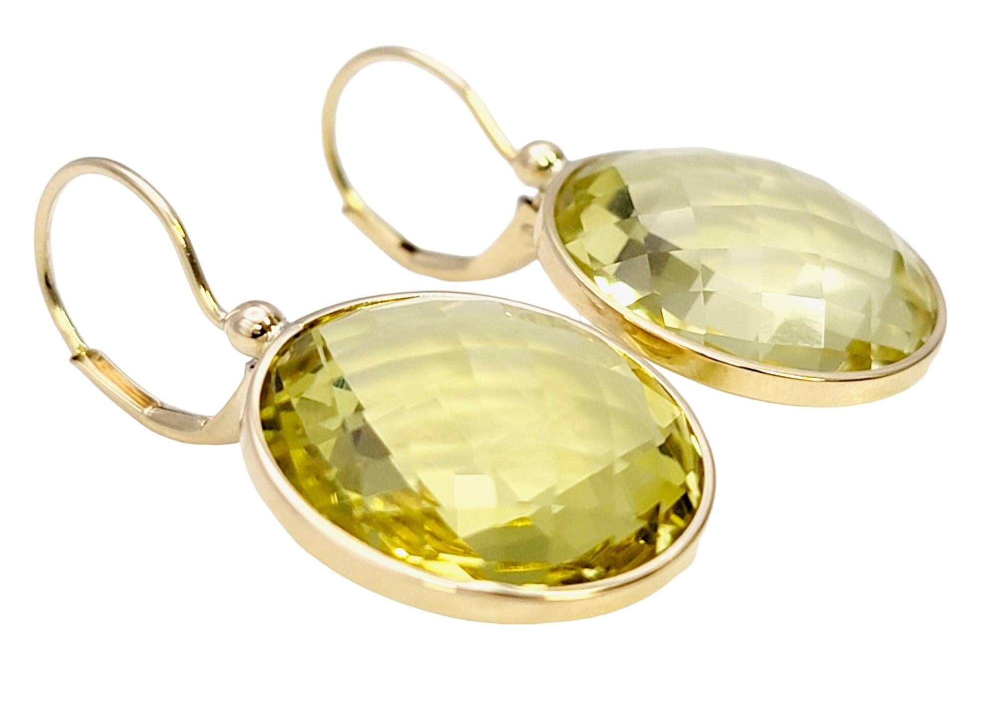 We absolutely adore these bright and beautiful citrine earrings! They have a simple yet elegant design and the perfect pop of cheerful color. 

These modern beauties each feature a single round checkerboard cut citrine stone bezel set in polished 14
