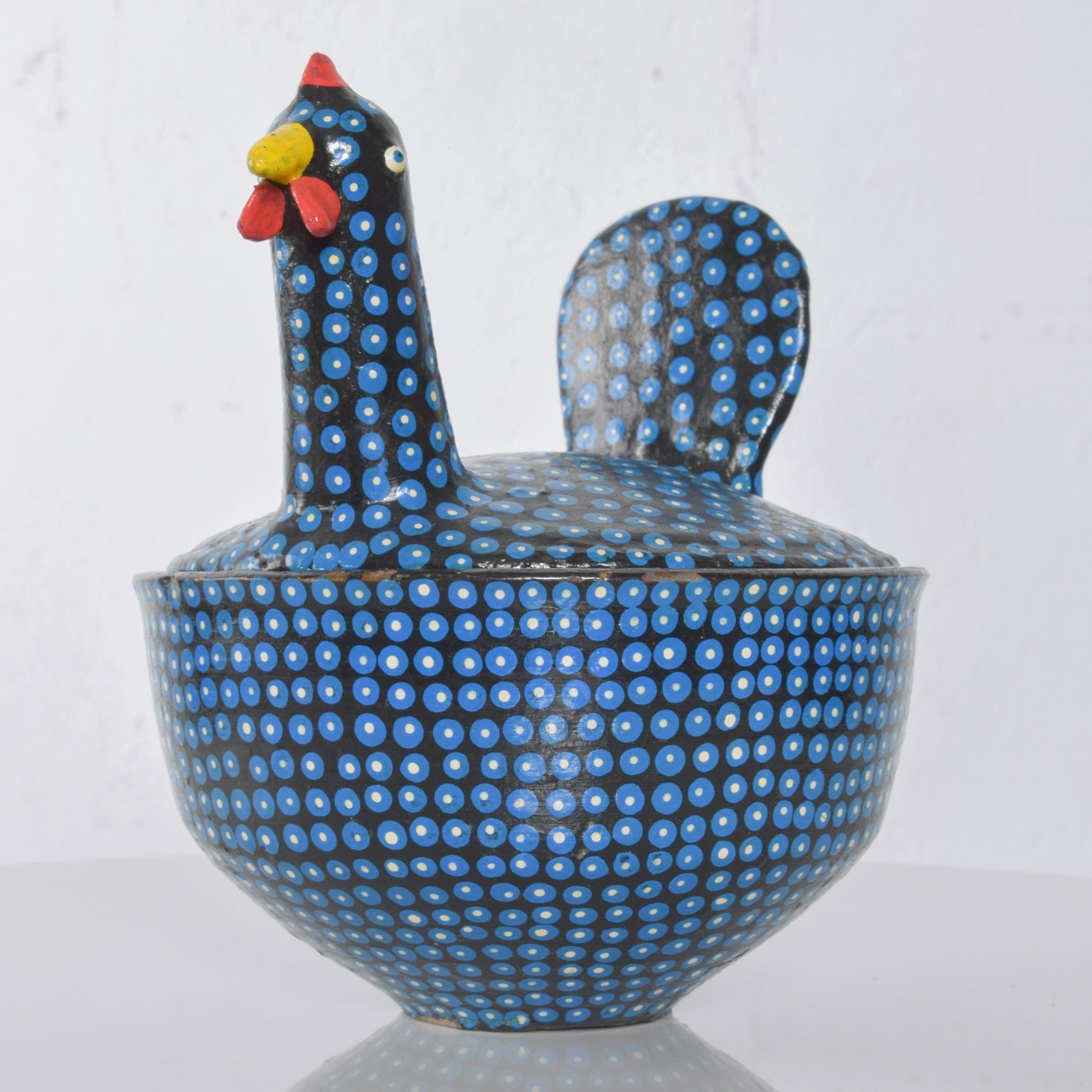 1970s modern hand painted blue colorful covered rooster chicken hen on nest ceramic pot with splashy red interior vintage midcentury delight!
Measures: 7.5 height x 7 in diameter
Original unrestored preowned no label condition. See images.