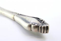 Cheese knife in embossed silver on the handle with a monogram card