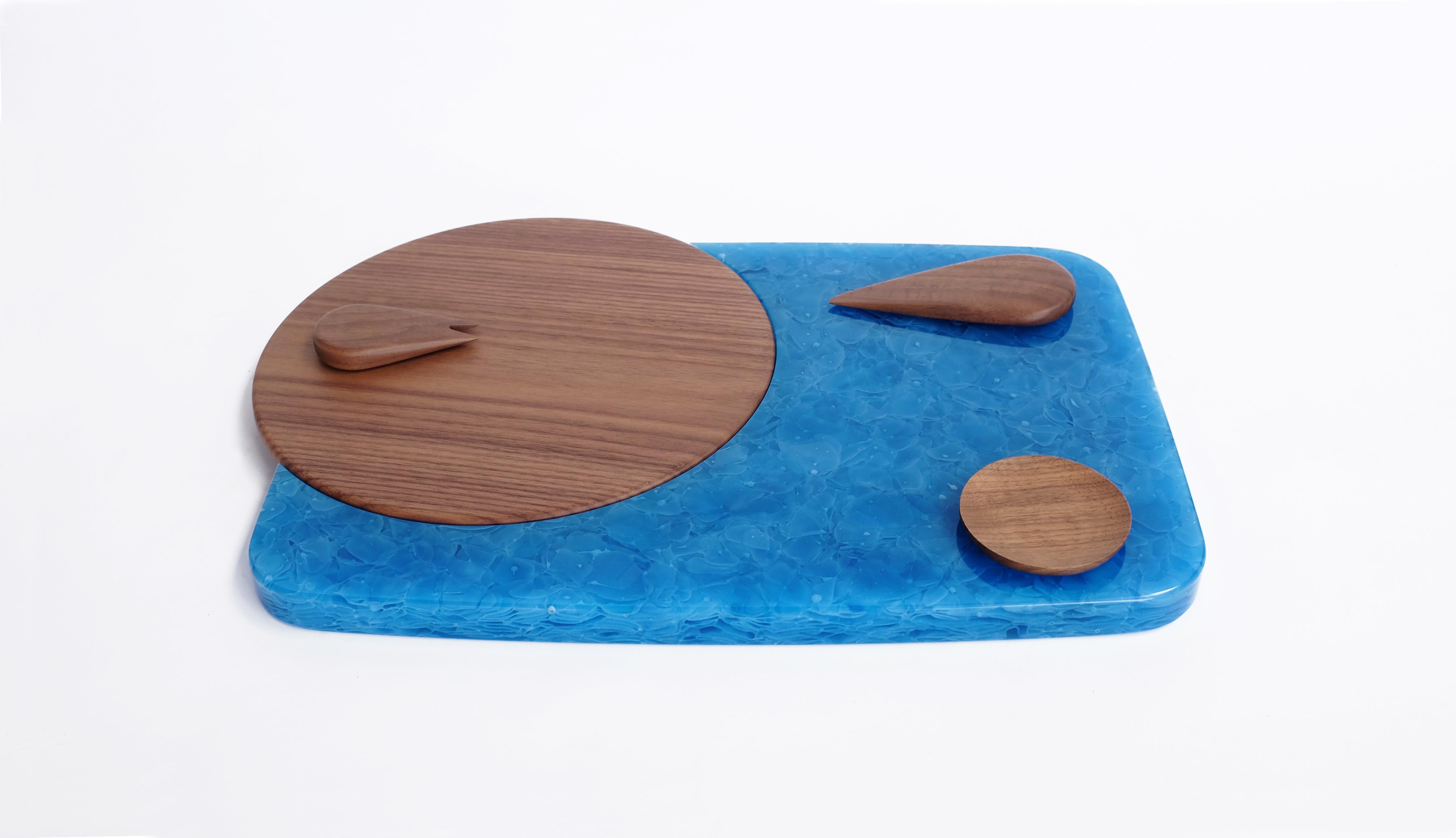 Cheese platter designed for wallpaper handmade exhibition in Milan, 2015

Designers Laetitia de Allegri and Matteo Fogale took inspiration from the shapes of cheese. Manufacturer Ceccotti Collezioni then crafted a circular American walnut display