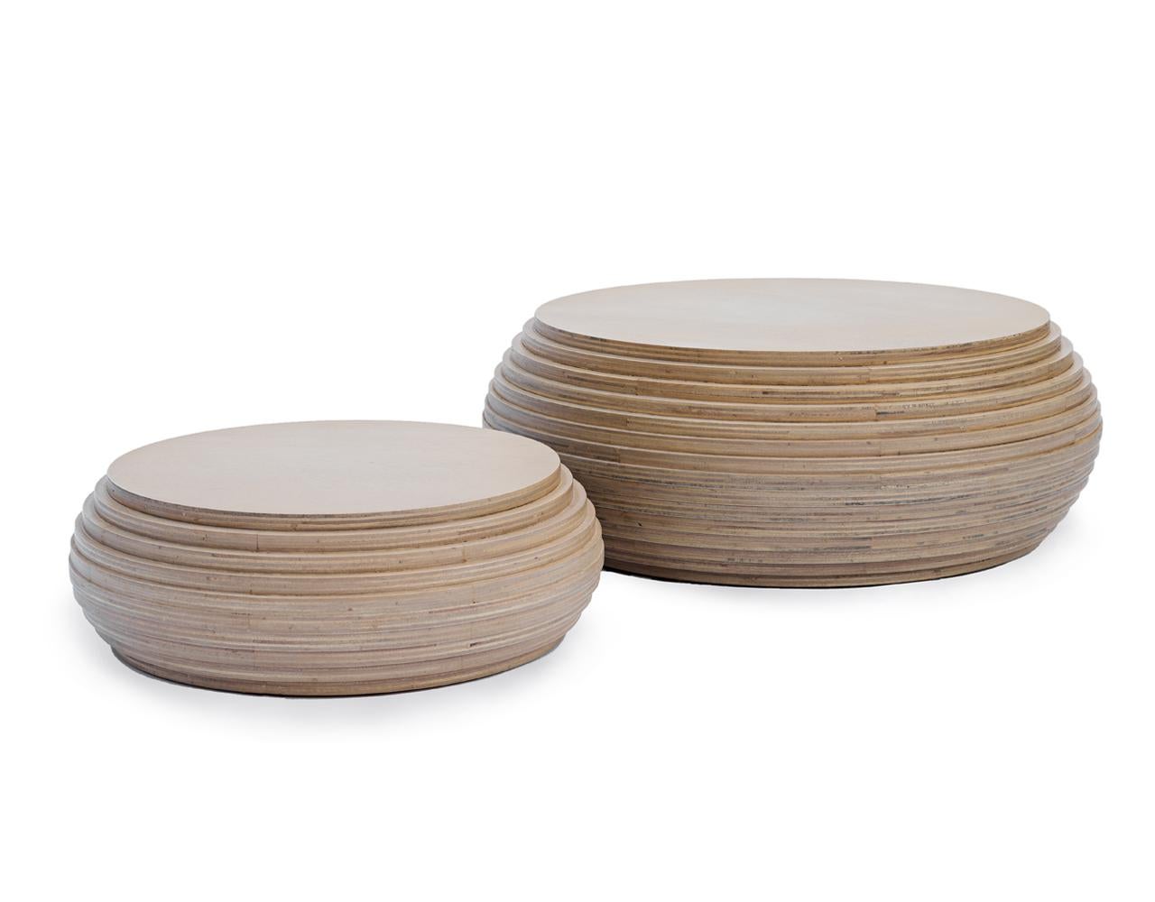 The Cheese Small Coffee Table is a distinctive and modern piece crafted from laminated plywood, showcasing the natural beauty and strength of this material. This table is designed with a minimalist aesthetic in mind, making it a versatile addition