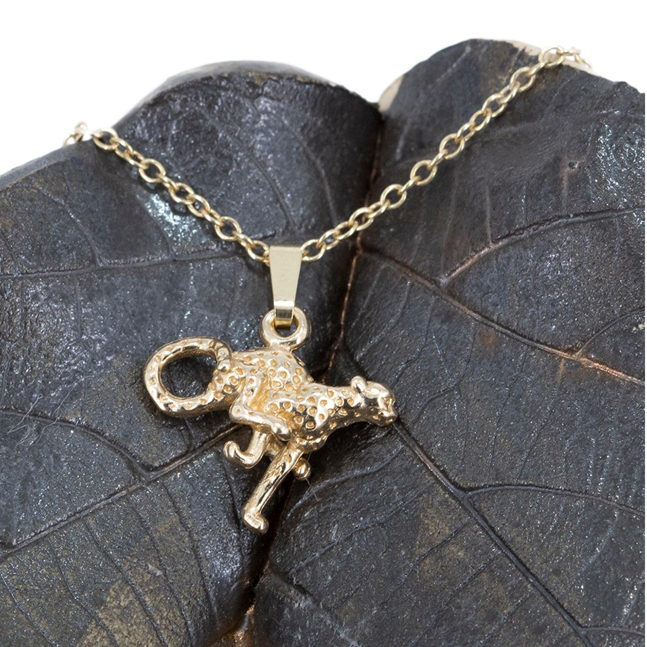 A beautiful solid 9 carat gold running Cheetah pendant with an 18