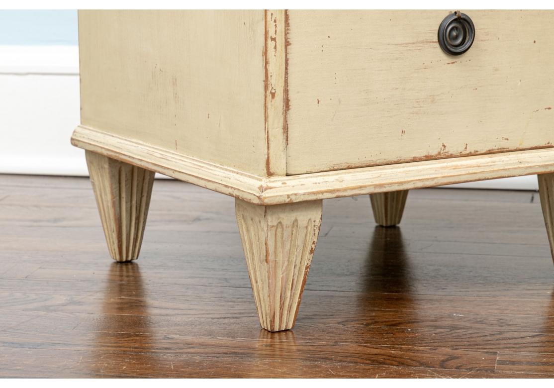 A very well made and stylish pair of drawer stands suitable for end tables or night stands. and Pair of Gustavian style four drawer nightstands with contrasting tops having a three-sided gallery edge all in a hand painted distressed finish.