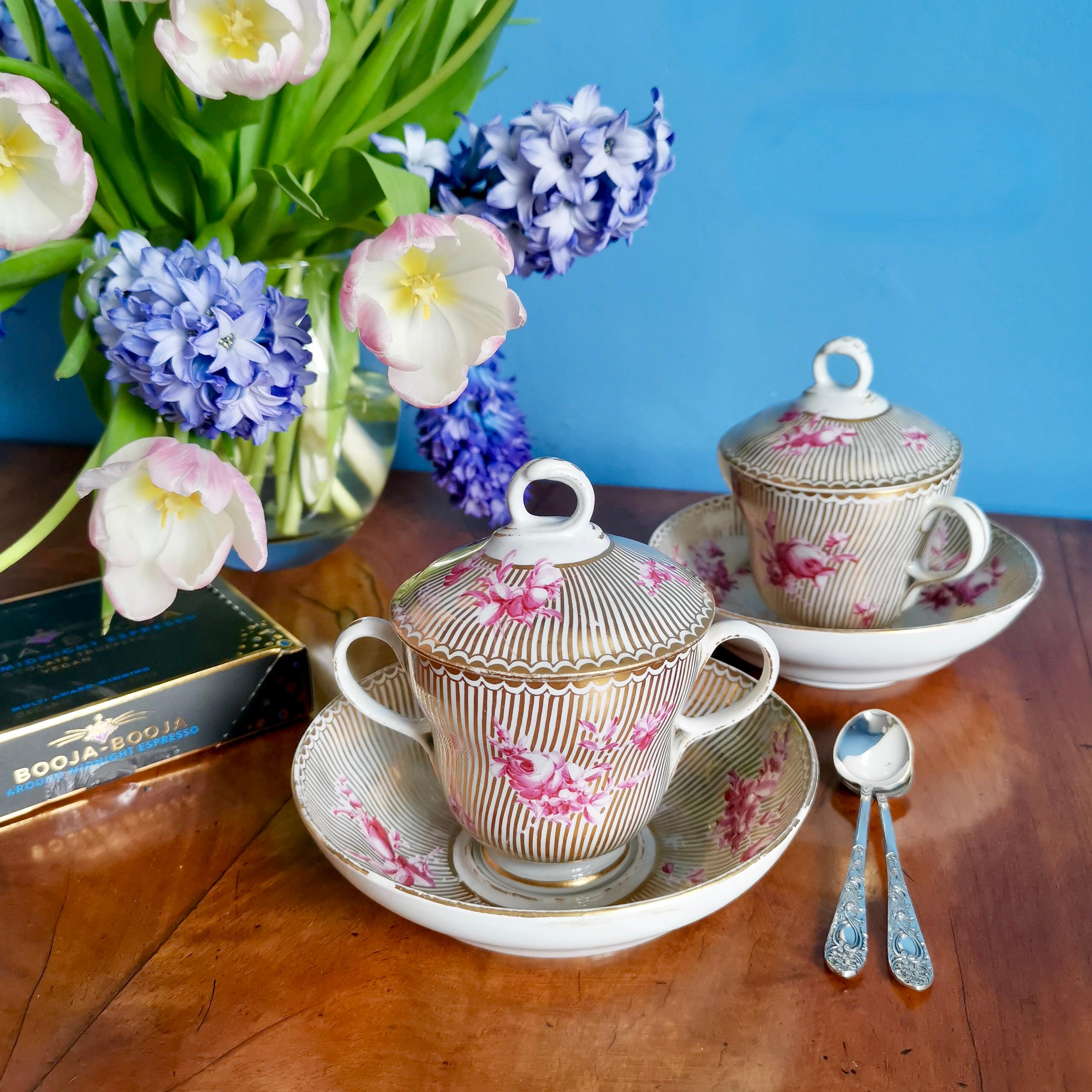 This is a beautiful chocolate cup set made by Chelsea-Derby between 1770 and 1775, which was the Rococo era. The set consists of a cup, a saucer and a cover, and is decorated in a stunning style with slightly psychedelic gilt stripes and elegant