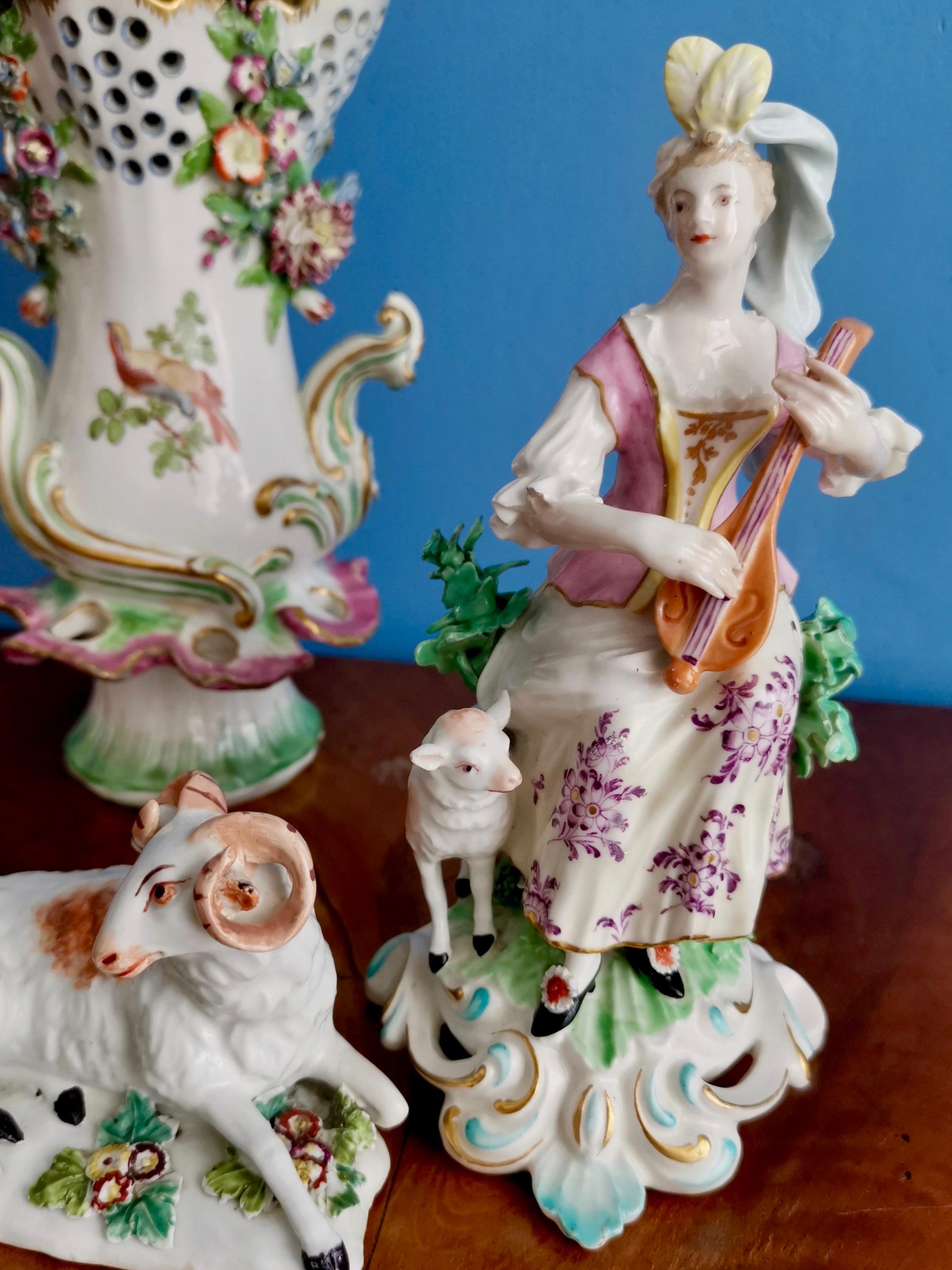This is a beautiful Chelsea-Derby figure of a lady with a lute made in circa 1770. This figure had been issued previously by Derby (in the early 1760s) and this is a re-issue from the early period when Derby had bought the Chelsea factory. The