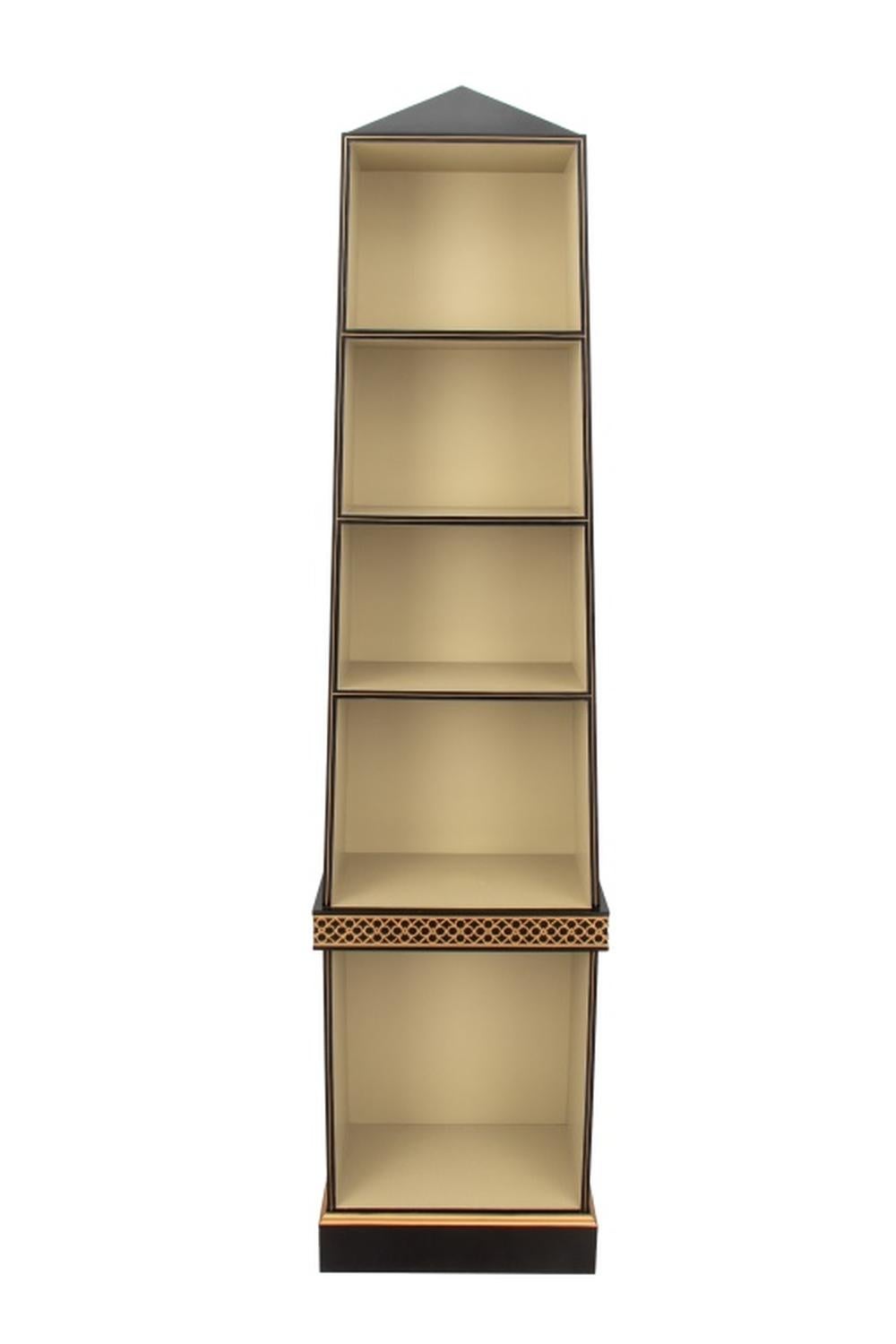 This is a Chelsea House Regency style ebonized wood étagère, featuring gilt trim and five graduated shelves. It has a gold-tone 