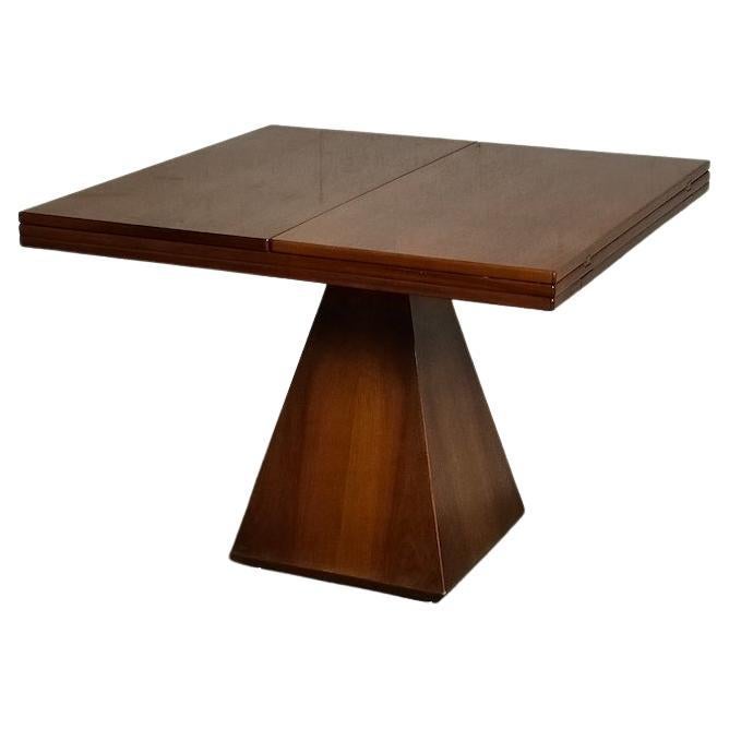 Outstanding exstandabel table designed by Vittorio Introini and manufactured by Saporiti in 1960s.
In really good condition.
Dimensions: 100 x 100 x 78 - open 200 x 100 x 75
Lacquered wood, chromed metal.

Vittorio Introini
Passionate
