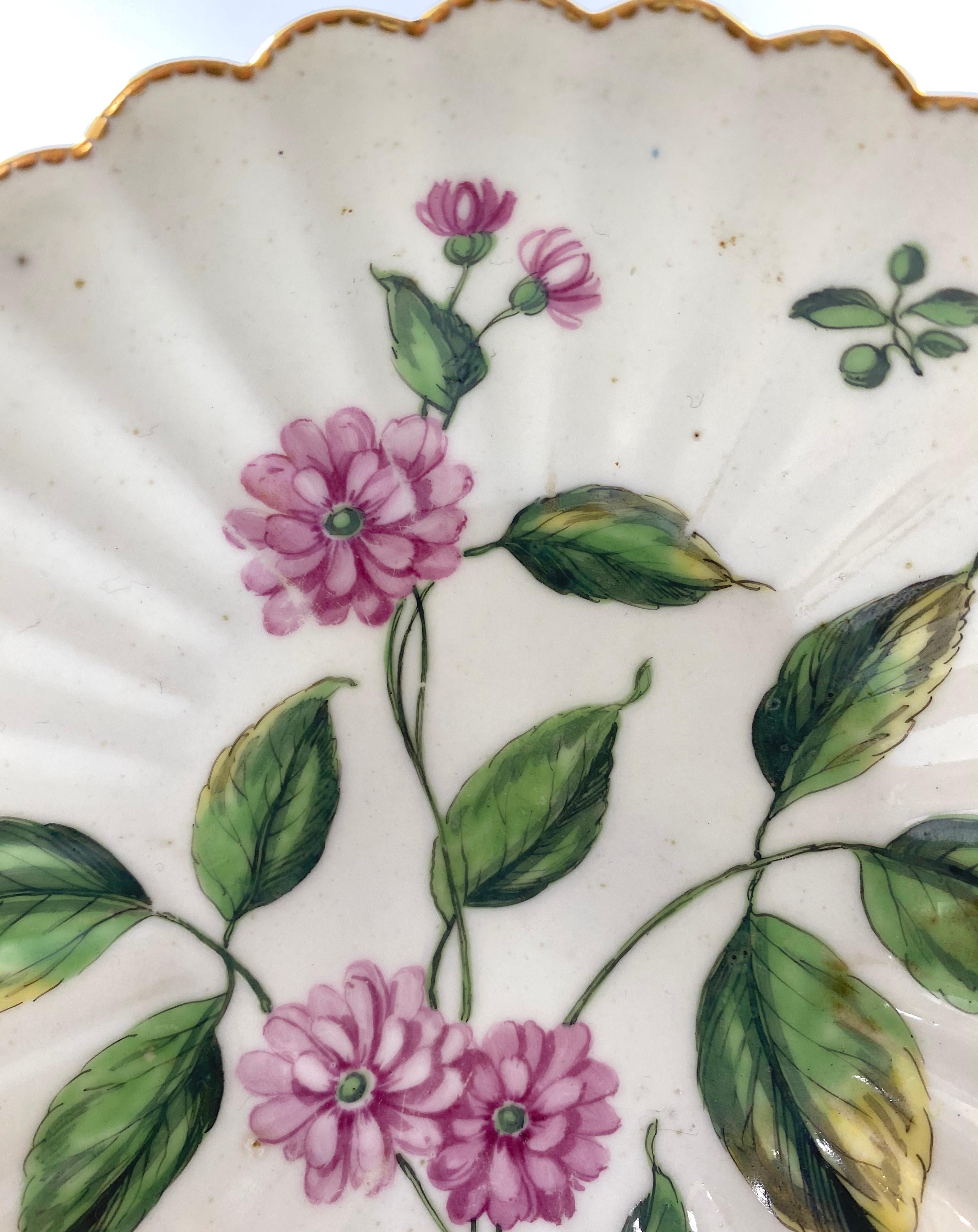 Fine and rare Chelsea porcelain saucer, c.1760. The finely potted saucer, of fluted form, and painted with a botanical study. Having a gilt dentil rim.
Red Anchor mark to the base.
Medium: Porcelain
Width: 14.8 cm, 5 7/8”.
Condition: Excellent.