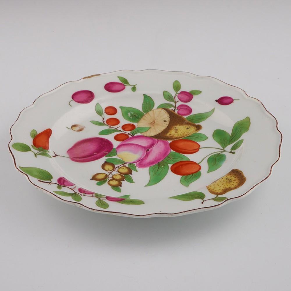 Heading :  Chelsea porcelain botanical plate
Date : c1760
Period : George II / George III
Marks : Brown anchor
Origin : Chelsea, England
Colour :Polychrome
Pattern : Enamelled with lemons, plums, damsons, tomatoes, and a pepper.
Features: Brown line