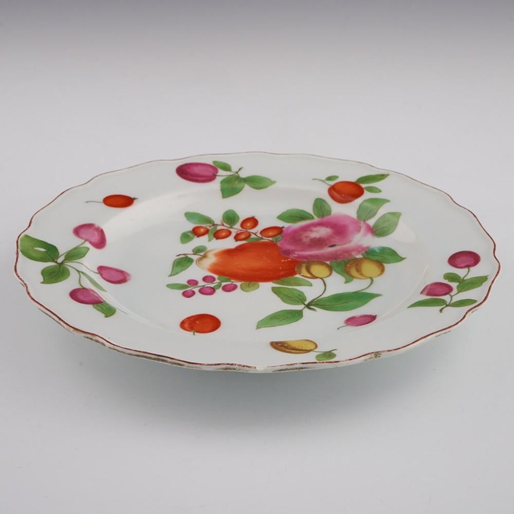 Heading :  Chelsea porcelain botanical plate
Date : c1760
Period : George II / George III
Marks : Brown anchor
Origin : Chelsea, England
Colour :Polychrome
Pattern : Enamelled with lemons, plums, damsons, tomatoes, and a pepper.
Features: Brown line