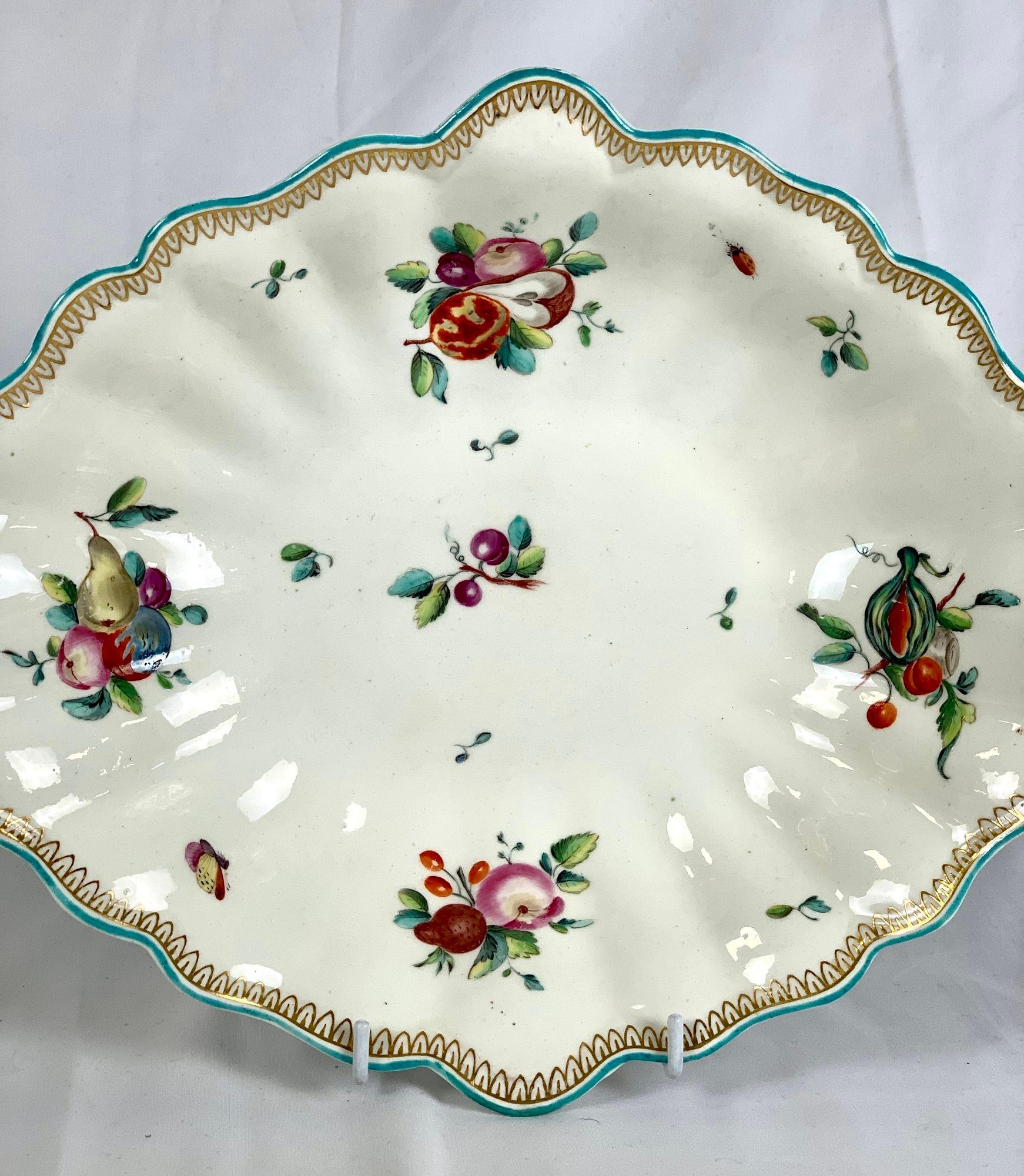 This gorgeous Chelsea Porcelain botanical dish was hand painted in England circa 1752-1756.
The polychrome enamels depict fruits: apples, pears, plums, melons, and, in the center, a delightful pair of cherries.
Four generous fruit clusters encircle