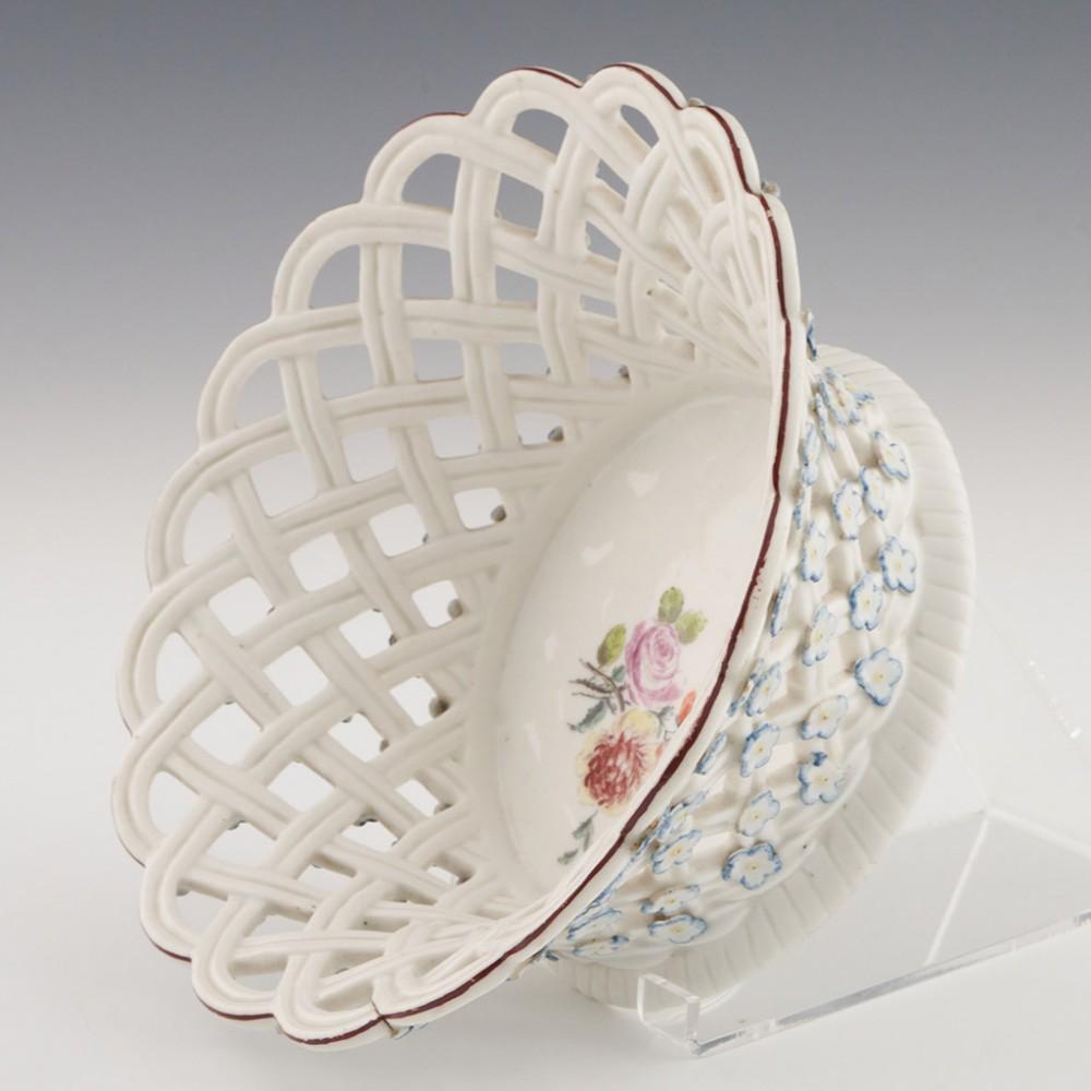 Heading : Chelsea porcelain reticulated basket
Date : c1755
Period : George II
Origin : Chelsea
Pattern : Pale blue and yellow applied forget-me-nots. Painted central floral bouquet

Features: Brown line rim
Condition : Excellent, a firing crack to