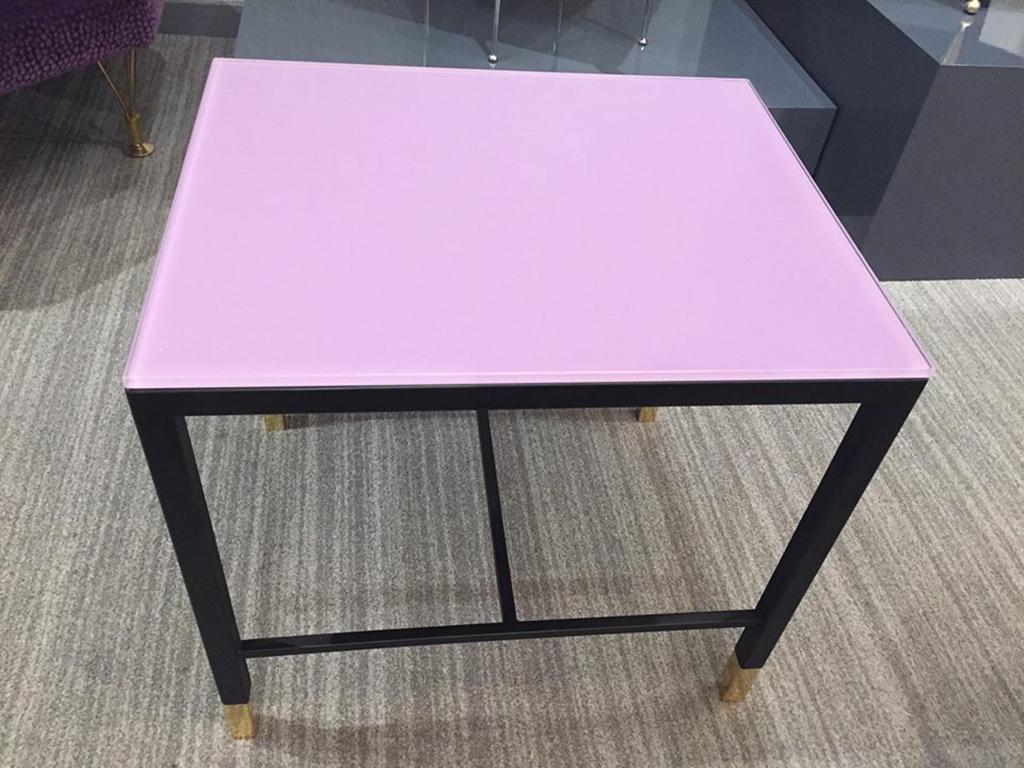 The Chelsea side table, designed by Irwin Feld for CF Modern, has a steel frame with four brass feet. The top of the base is open and topped with reverse painted glass. Shown here in Lavender. 

CF Modern merchandise is available in custom sizes,