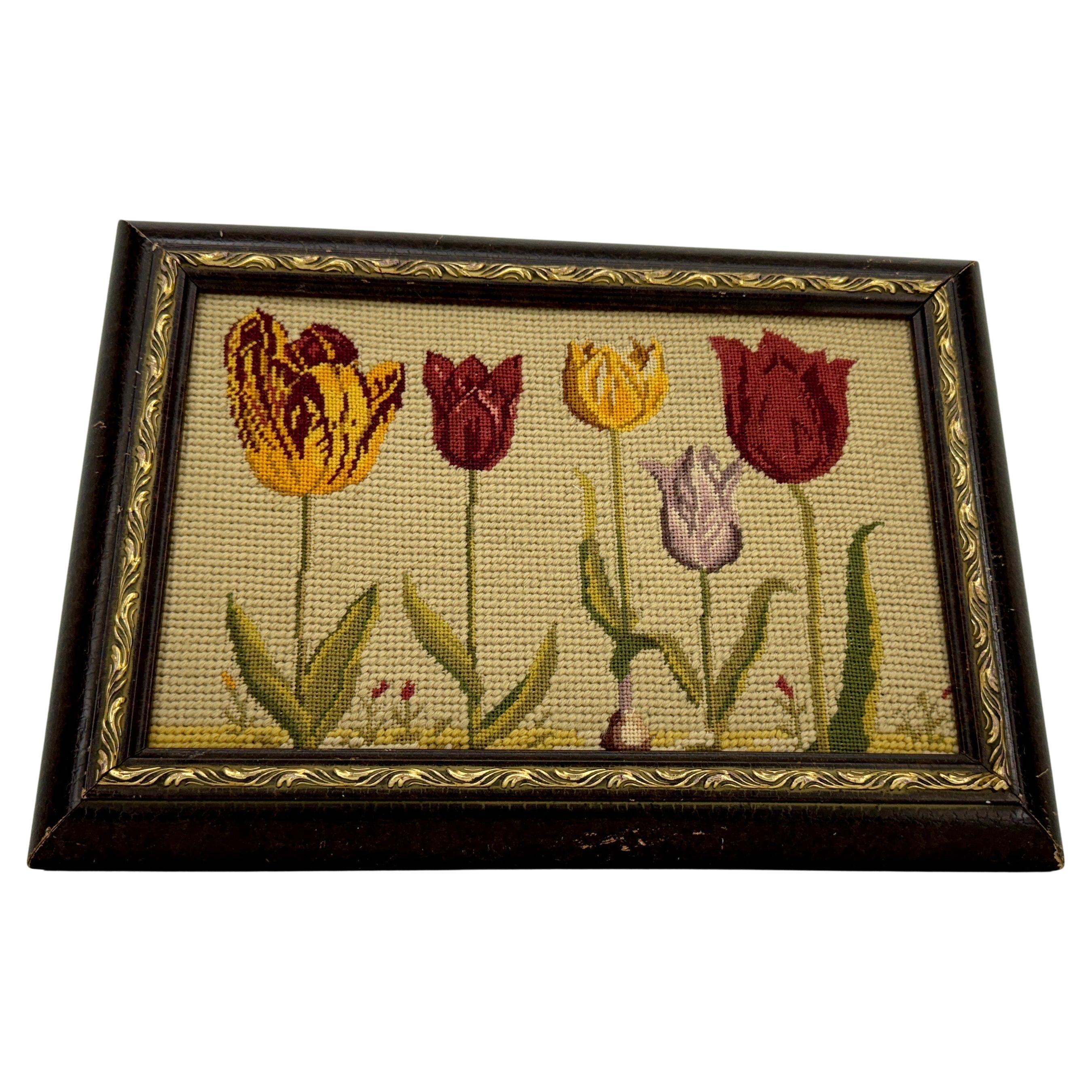 Needlepoint Wood Framed Artwork of Tulips from Chelsea Textiles

One-of-a-kind needlepoint artwork from Chelsea Textiles. This framed artwork features tulips in rust, orange, yellow and green colors. This classic piece of art would make a suitable