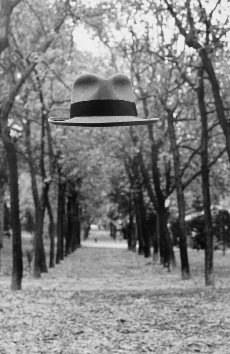 Chema Madoz Black and White Photograph - Untitled - (Floating hat in tree path)