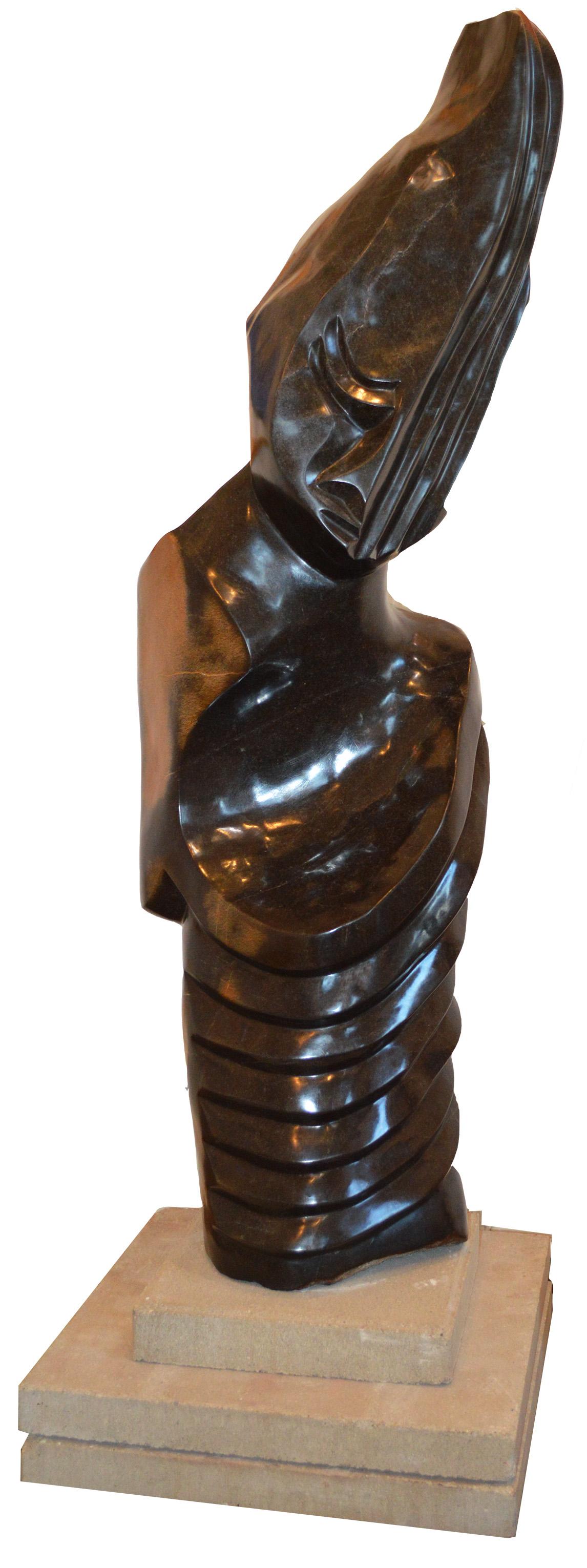 Amigo que escucha" es una escultura original de piedra de manantial firmada por el artista zimbabuense Chemedu Jemali. La escultura presenta la cabeza y el torso de una figura, muy abstraída en el estilo característico de Jemali: La cabeza de la