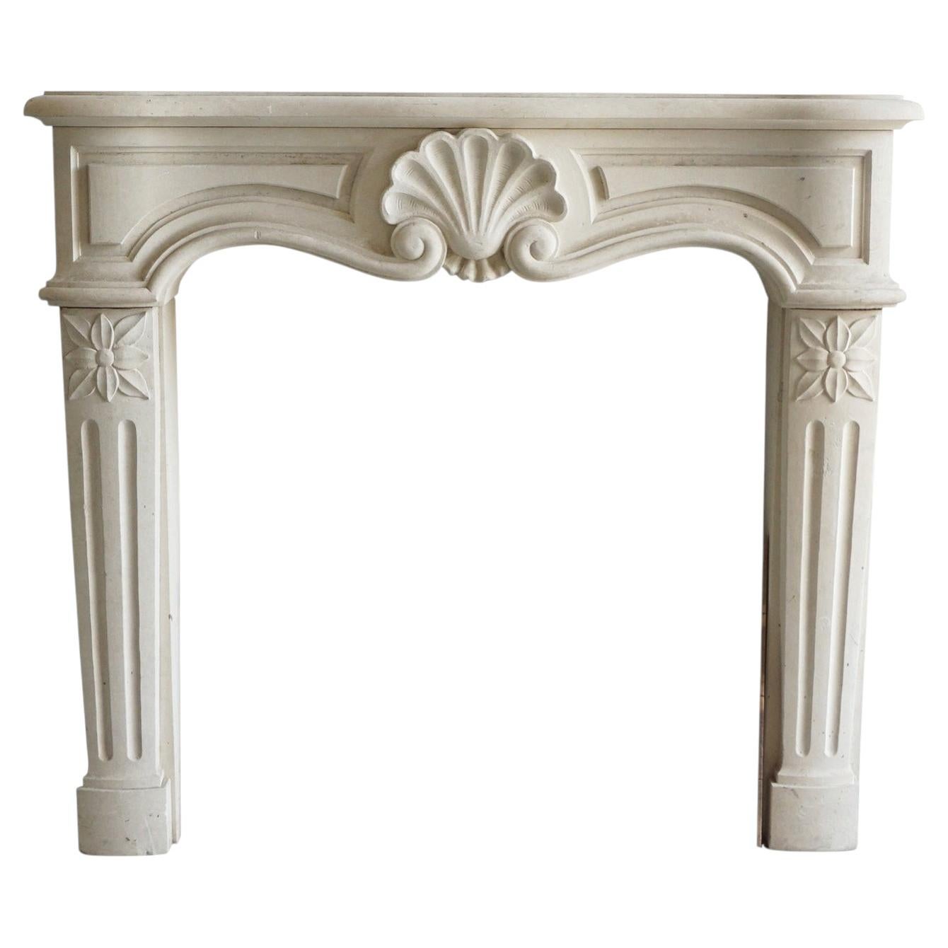 Antique Louis XV Style Hand Carved Limestone Fireplace, 20th Century