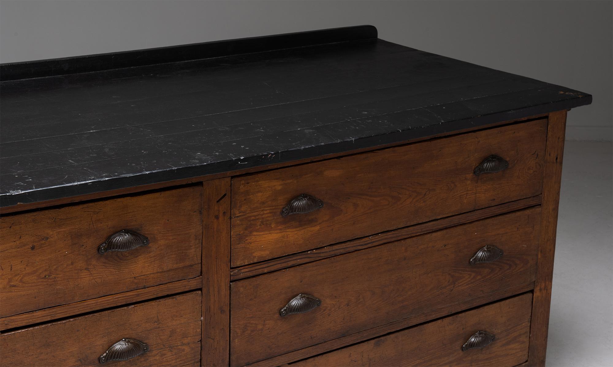 Chemists cabinet

England Circa 1900

Mahogany plank top in ebonised finish with pine drawers and body. Original brass pulls.

Measures: 85.5”w x 33.5”d x 35.5”h.