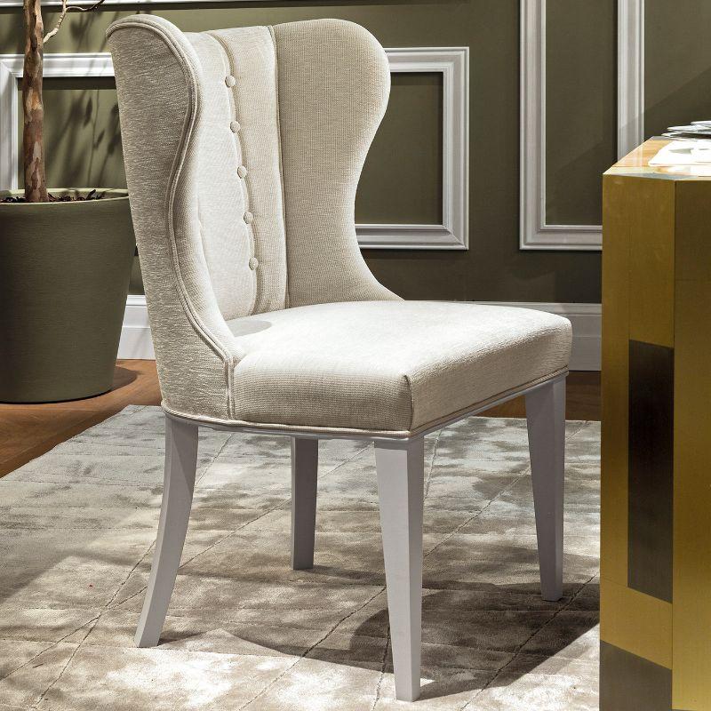 A total-white look to elevate the look of a dining room, this stupendous chair will make a gorgeous head-of-the-table especially when paired with others from the same series. Entirely upholstered with chenille fabric boasting a mother of pearl tone,