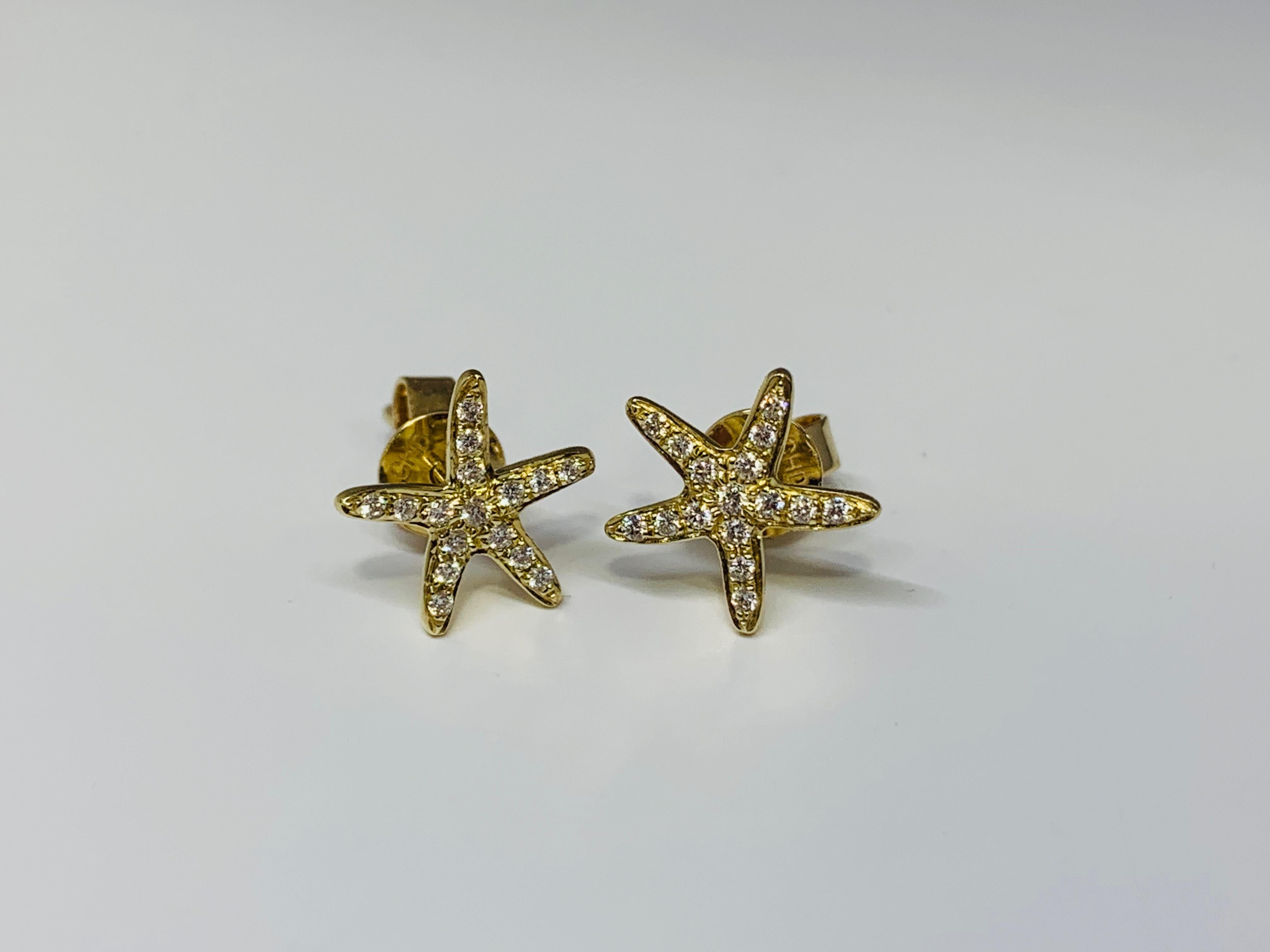 These stunning Cherie Dori Starfish earrings feature a total carat weight of 0.15 round diamonds set in 14K yellow gold with strong tension earring backings. Each of the starfish measure 1/2