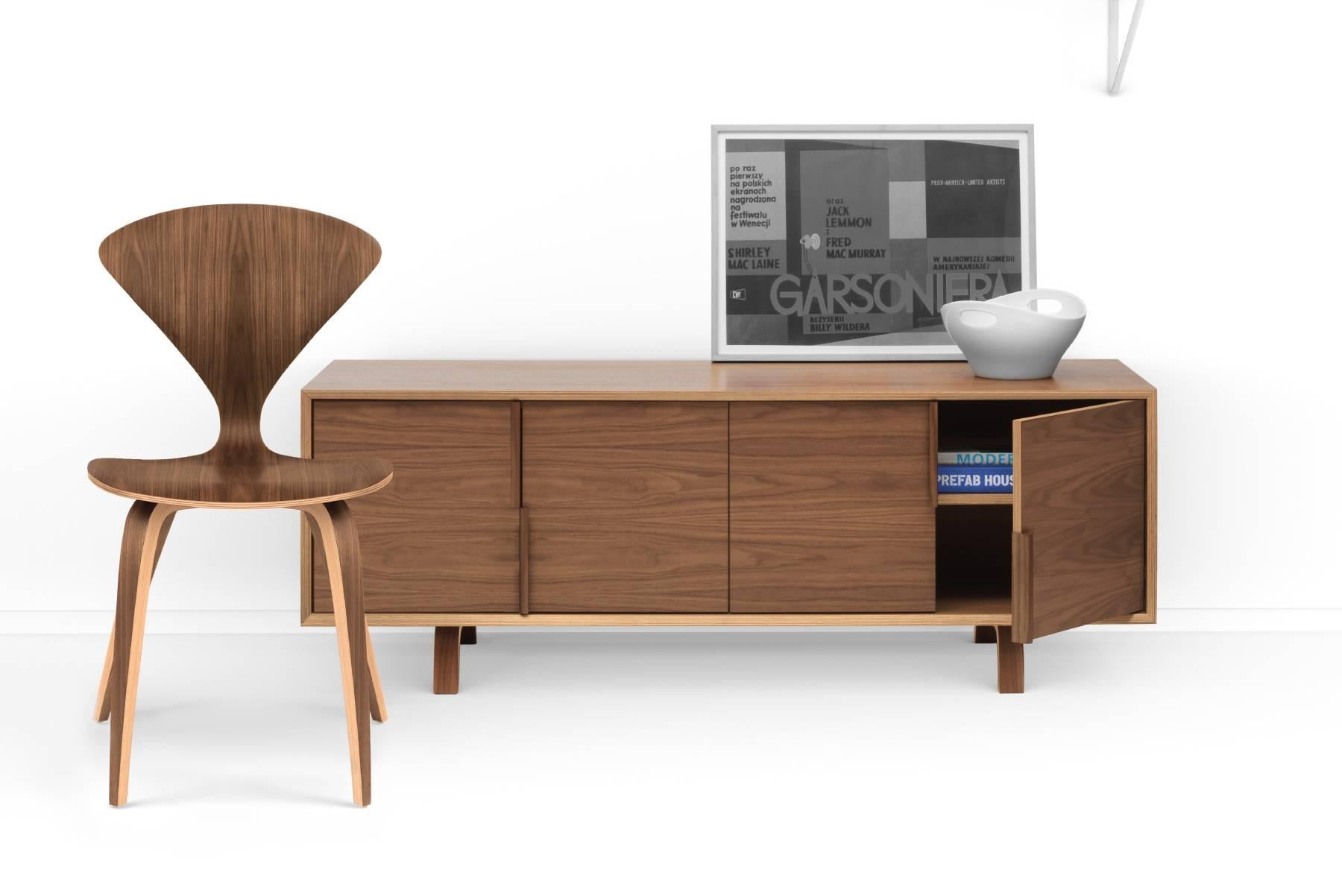 Multiflex casegoods are lightweight, strong and made entirely from laminated, cross-ply and molded plywood. Clear or Classic finish on American Walnut veneers are complimented by the exposed mitered and curved plys of the geometric case and molded