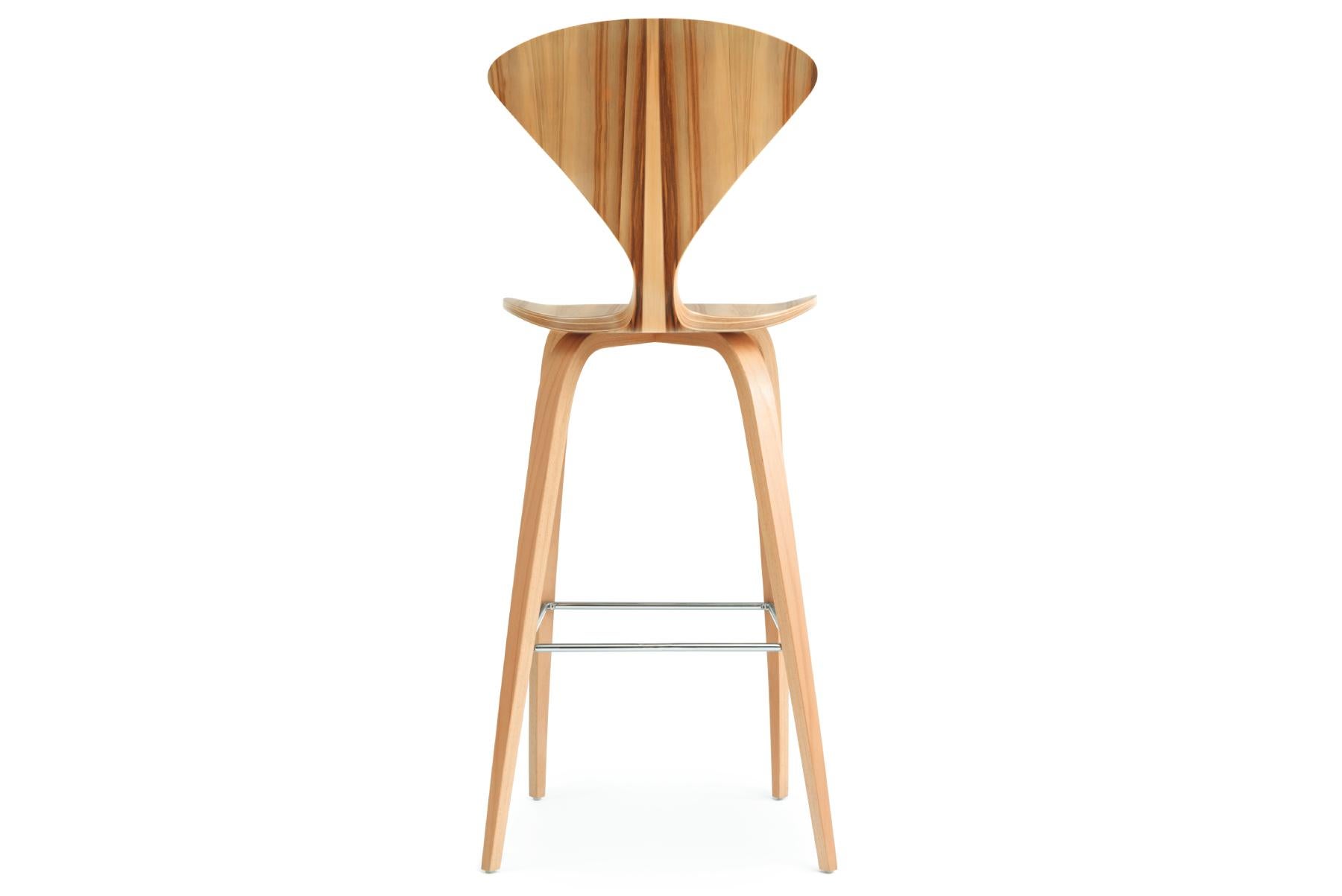 The 1958 molded plywood stools by Norman Cherner have been seen in some high places. Available in counter or bar height with a wood or metal base. The seat is made of laminated plywood of graduated thickness, from 15 plys to 5 plys at the perimeter