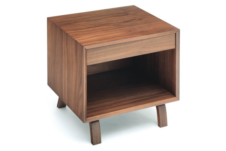 Perfectly scaled storage with a single drawer. The new bedside tables are built entirely from laminated, molded and cross-ply plywood. American Walnut veneers and contrasting exposed edge laminations create a strong geometry and highlight the