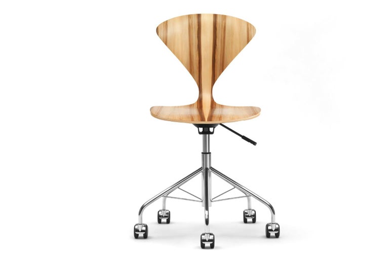The 1958 molded plywood task chair by Norman Cherner is now available to a new generation of furniture collectors. A strong, lightweight and graceful addition to the home or office. The task chair is available with or without arms in all Cherner
