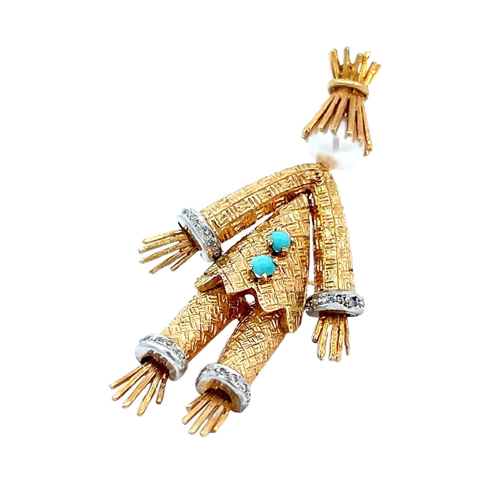 Cherny cultured pearl, diamond, and 18-karat scarecrow brooch. The scarecrow is wearing a textured gold suit with diamond cuffs on the jacket's arms and pant legs. The scarecrow has textured gold, made to look like straw, for the hands, feet, and