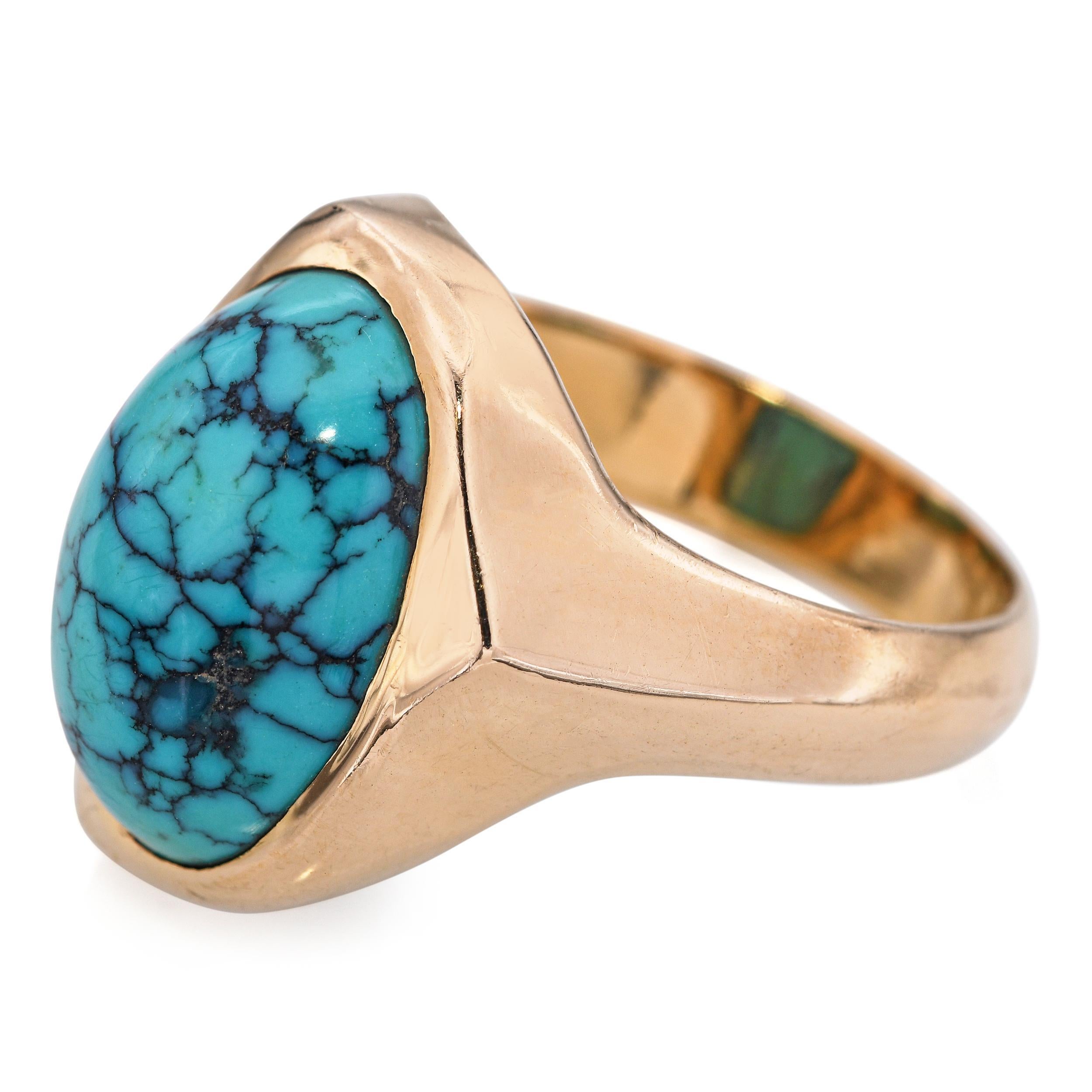 Cherokee artist Lee Epperson 14k Yellow Gold Turquoise Ring, showcasing a vibrant turquoise cabochon with natural matrix patterns. The stone is bezel set in a smooth and warm 14k yellow gold frame, emphasizing its bold blue-green hue. The band is