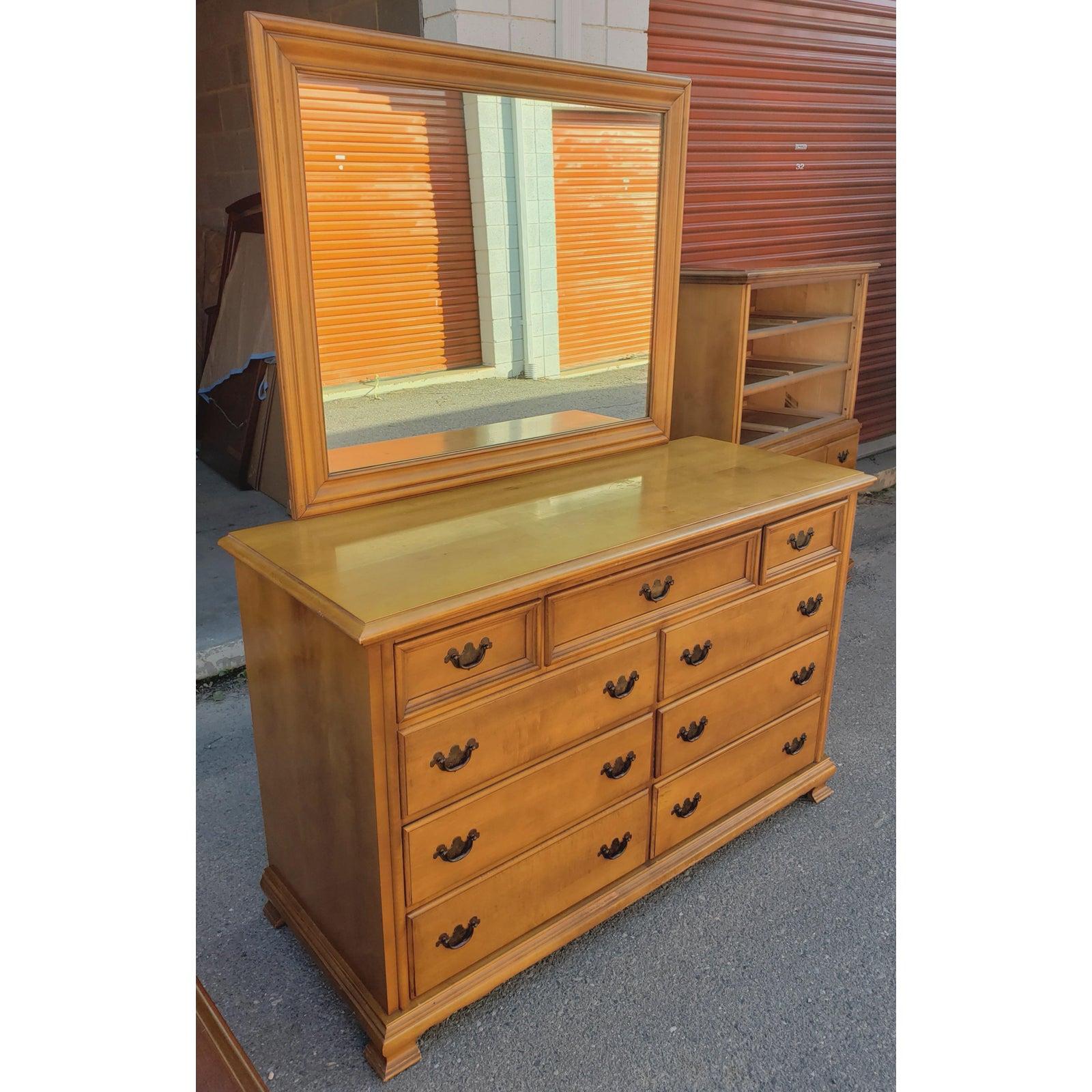 Mid-Century Modern solid maple double dresser with mirror from Cherokee Furniture.
 Dresser measures, 53”w x 20 1/2d x 34”h.
 Mirror measures, 42”w x 33”h.

All dovetail drawers work as originally intended. Very Solid Construction.
We have a