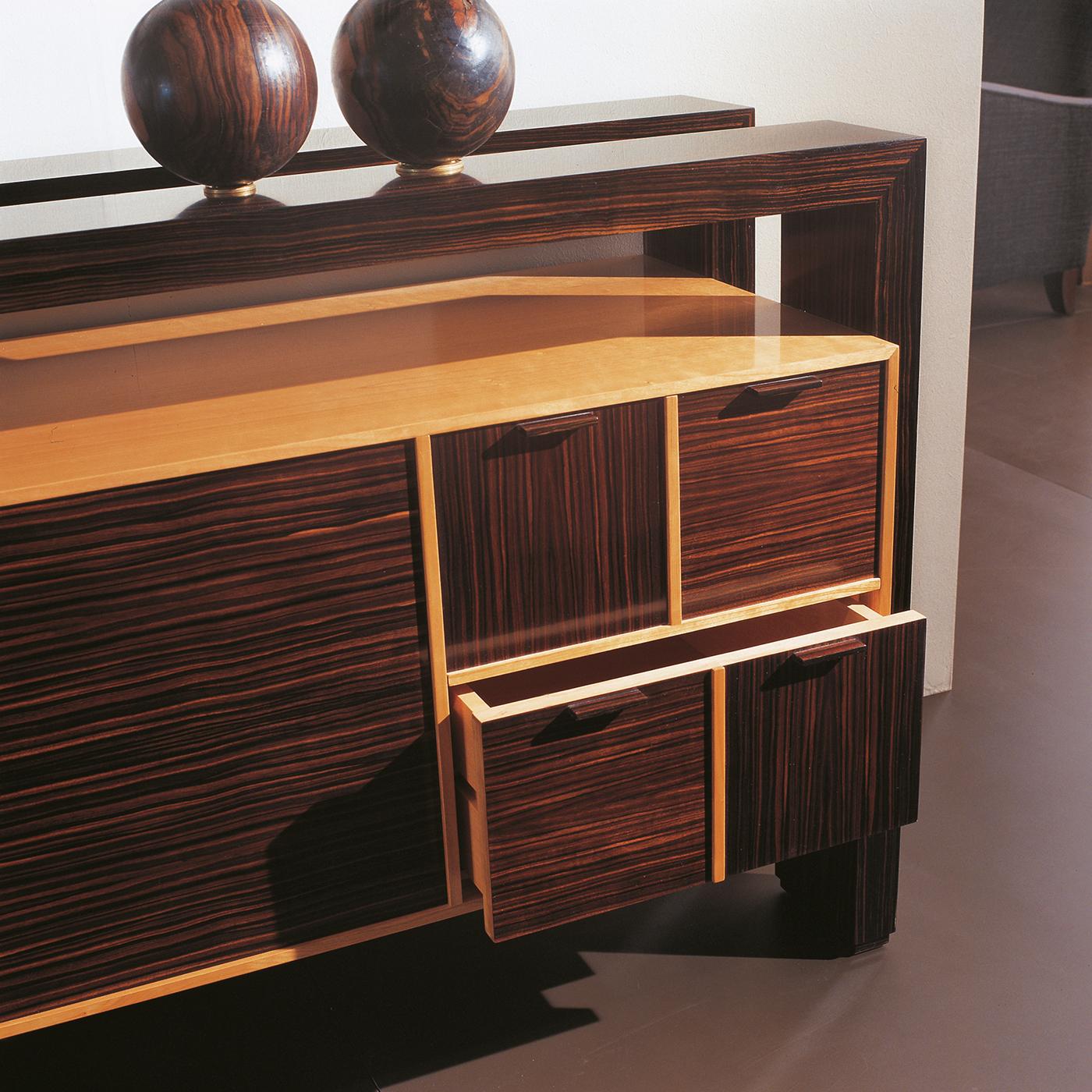 This fascinating sideboard will make a bold and precious statement in exquisite modern decors, either commercial or residential. Including the pictured ebony tray, the design is distinguished for its clean and sober lines made unique by the