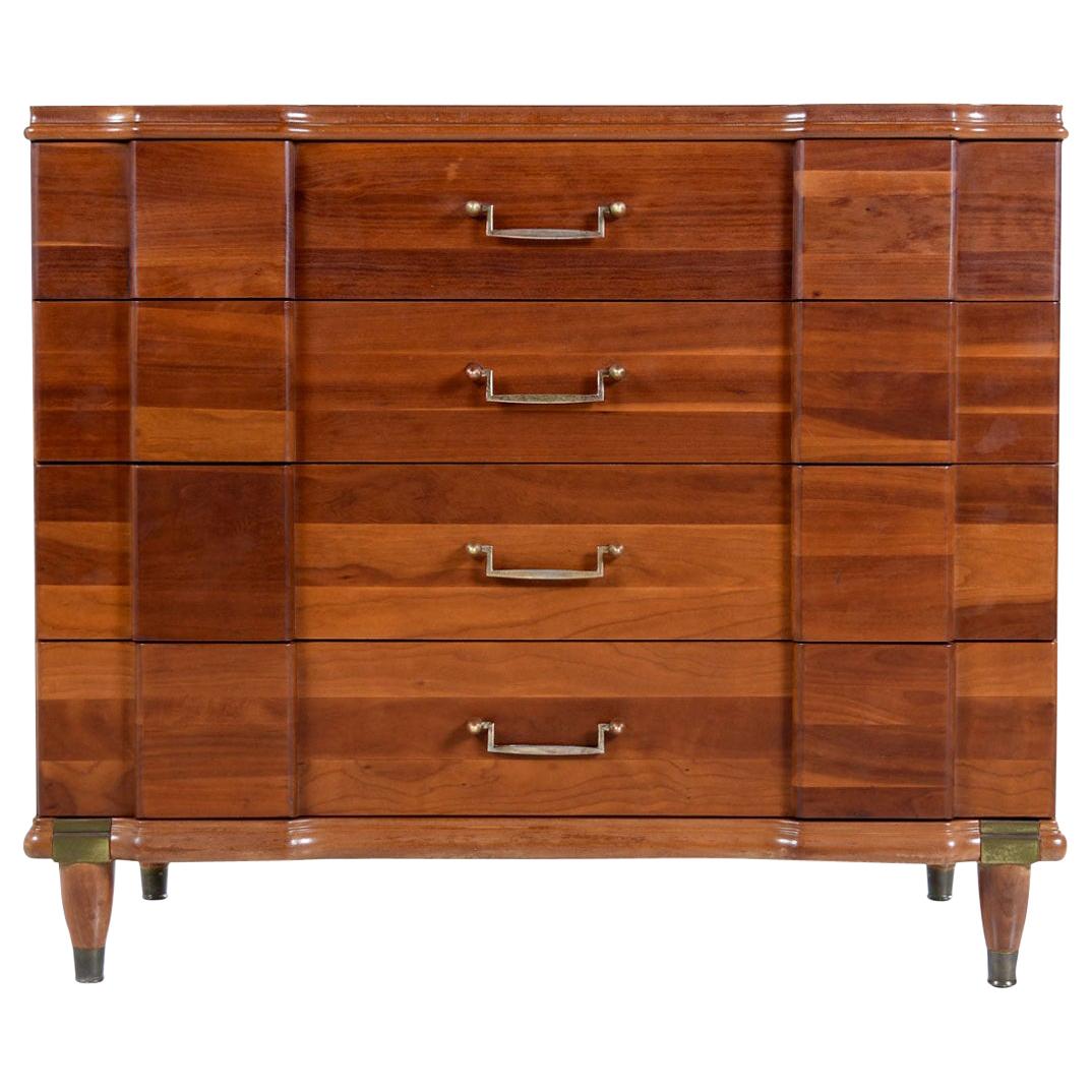 Made by Hickory Manufacturing Furniture Company, this cherrywood dresser is an interesting hybrid of many styles. The machine age pulls, Campaign brass accents and Art Deco bump-outs make it tough to categorize the exact look. Regardless, it’s a