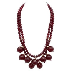 Collana in bachelite e oro con ciliegia