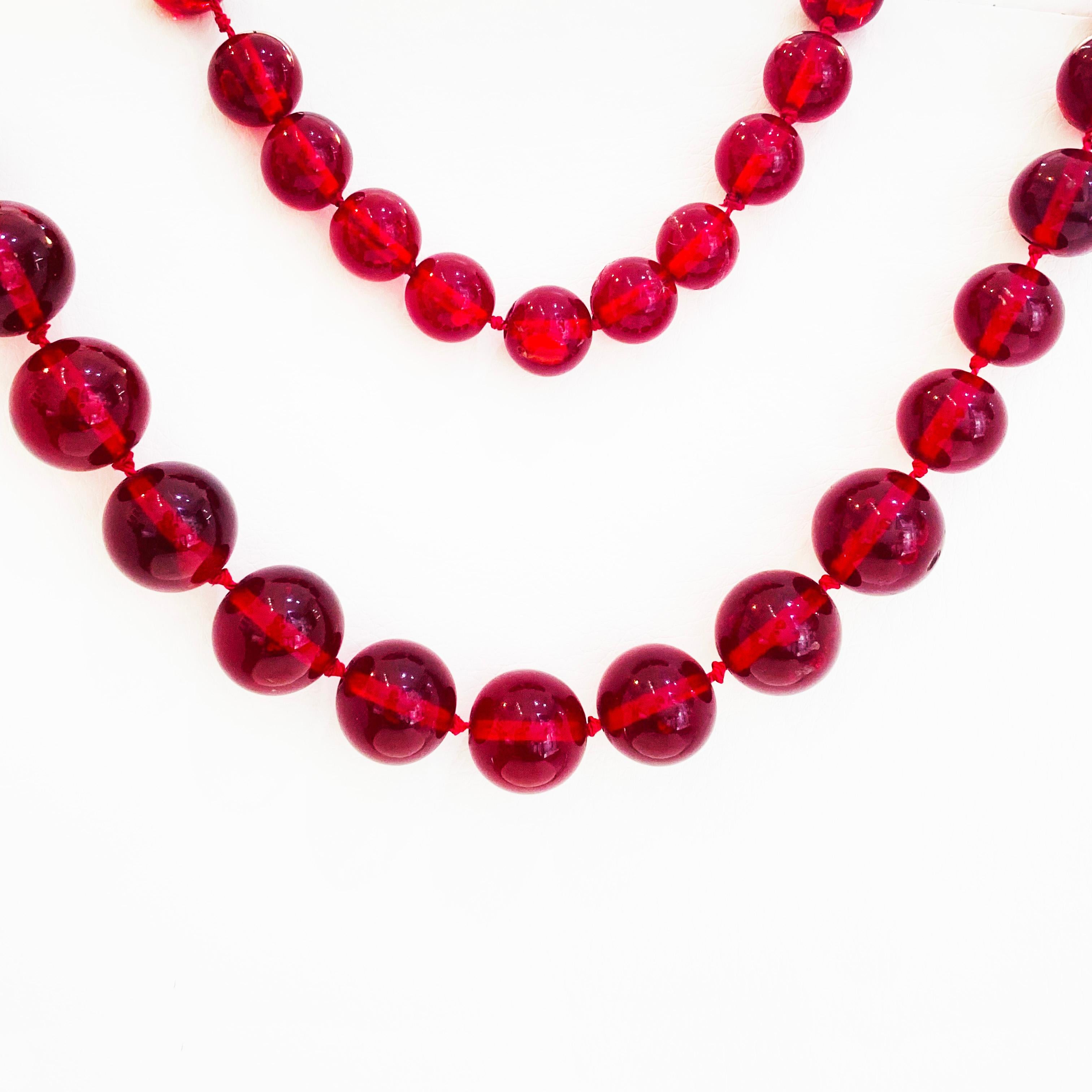 These authentic Baltic amber are a beautiful cherry color and look gorgeous on anyone!  They are large at 12.5 millimeters round amber beads to the largest 18.5 millimeters.  The necklace is strung on a gorgeous red silk thread with infinity