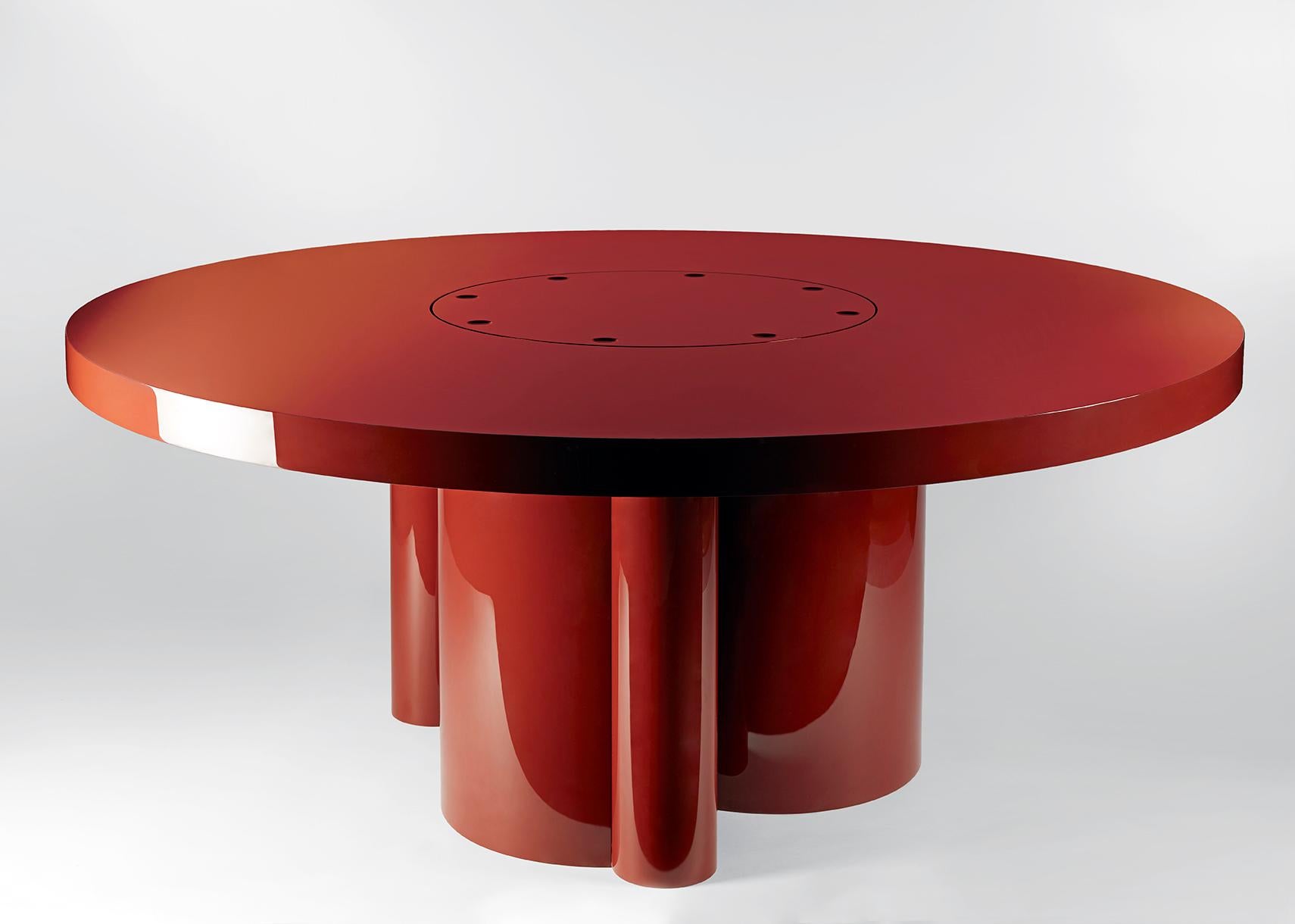 Cherry dining table by Gisbert Pöppler
Dimensions: D 180 x W 180 x H 74 cm
Materials: red lacquered aluminum

The refreshing red is not the origin of this dining table’s name, but rather the playful form of its base! Shaped like cherries with curved