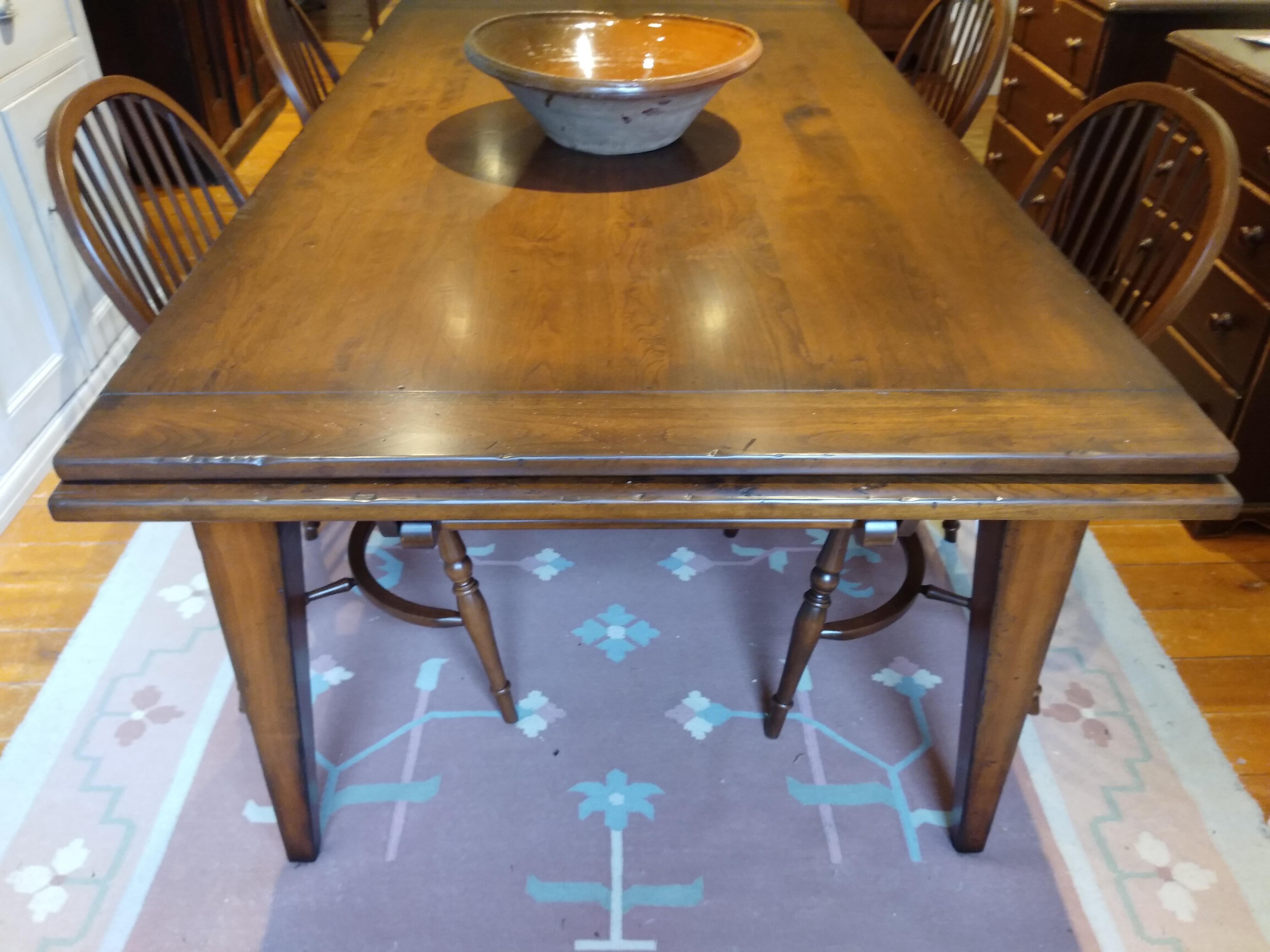 The dealer that makes us wonderful chairs in the US also makes a reproduction draw leaf cherry table in a wide variety of colors and fabulous patina. Each table comes with 2 x 20 inch leaves on either end -- and the leaves are easy as pie to put