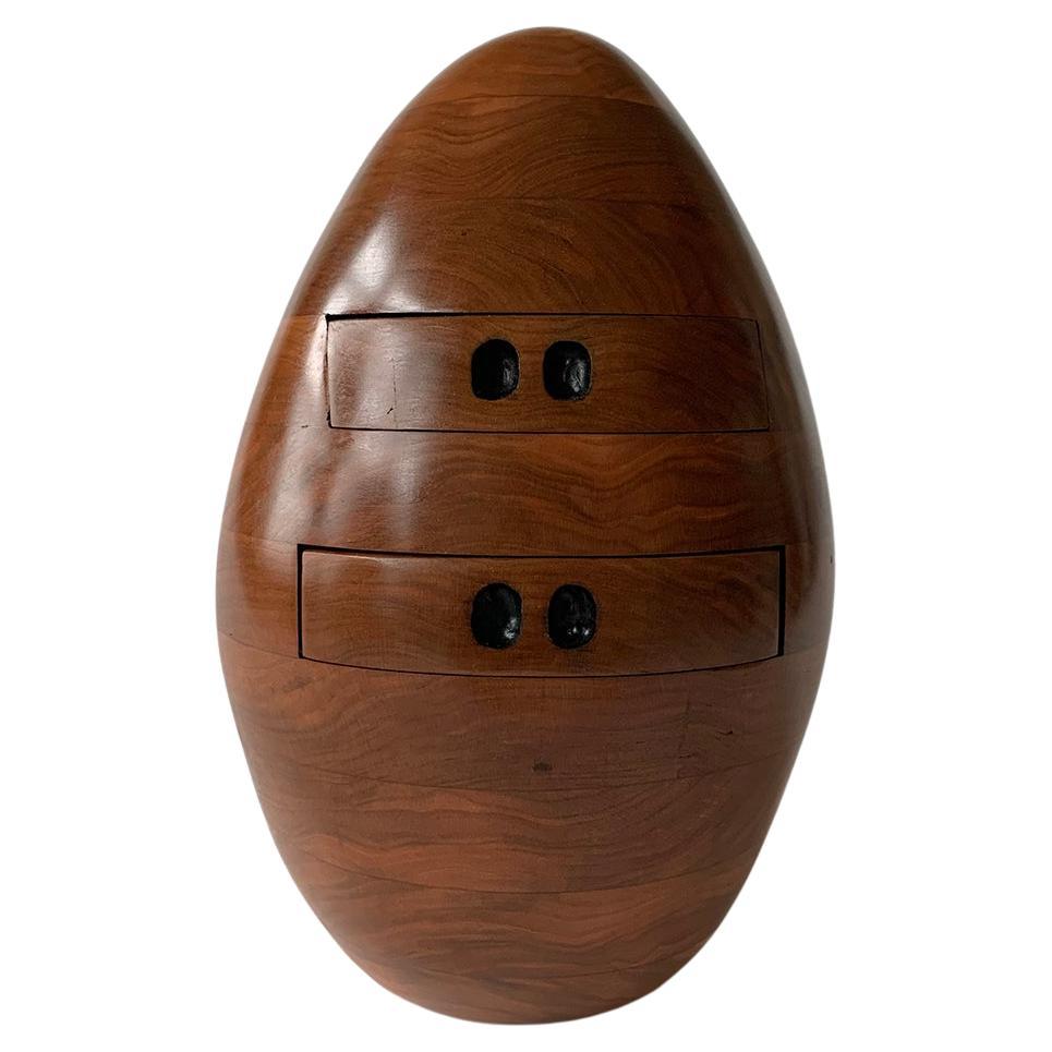 This hand-carved wood egg sculpture is also a functioning object, with small working drawers capable of storing small collectables.

Steve Turner
Cherry Egg, 2021
cherry wood
12.50H x 7.50W x 7.50D in
31.75H x 19.05W x 19.05D cm
SJT019

Artist