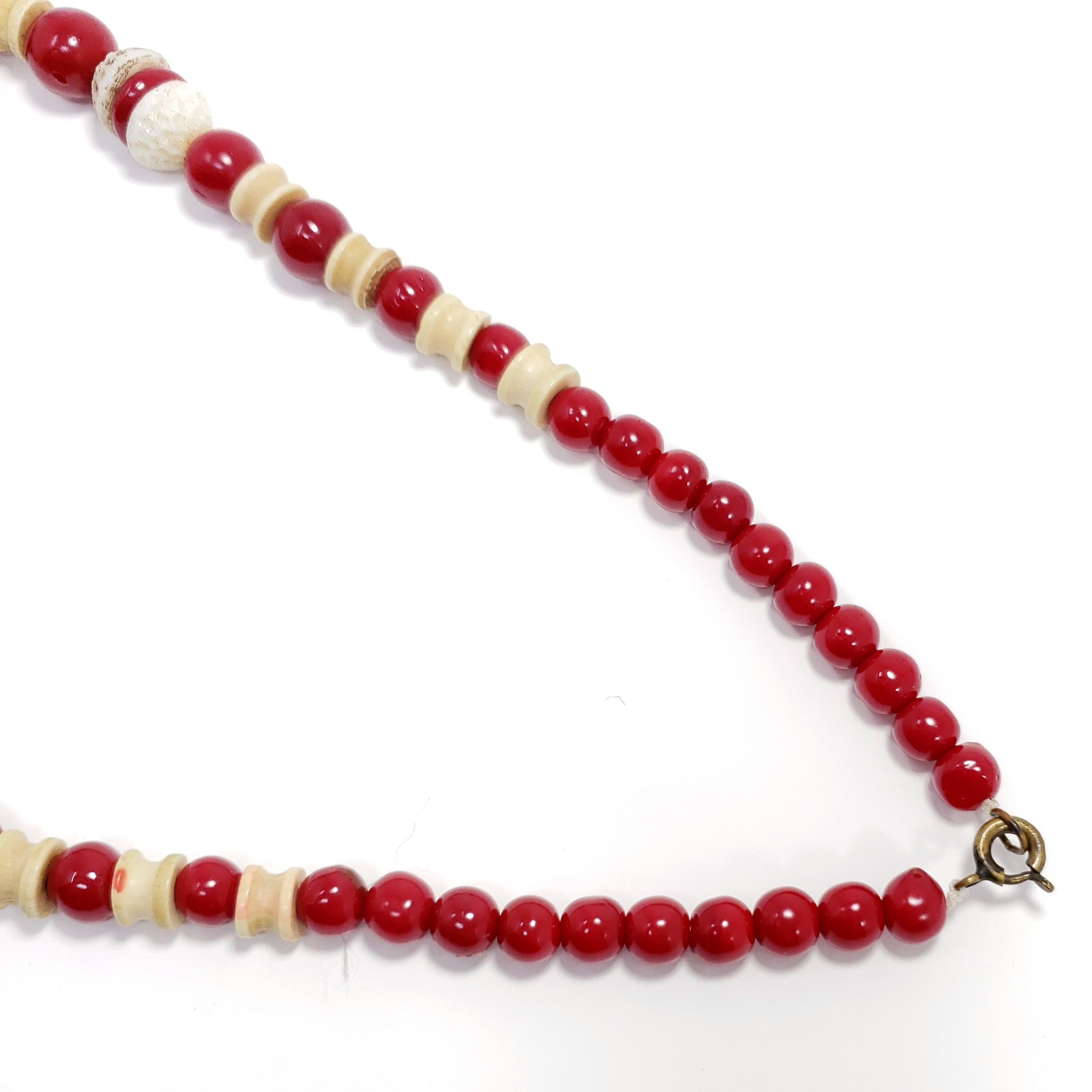 Retro Cherry Red and Cream Colored Carved Bakelite Bead Necklace, Brass Tone Clasp For Sale