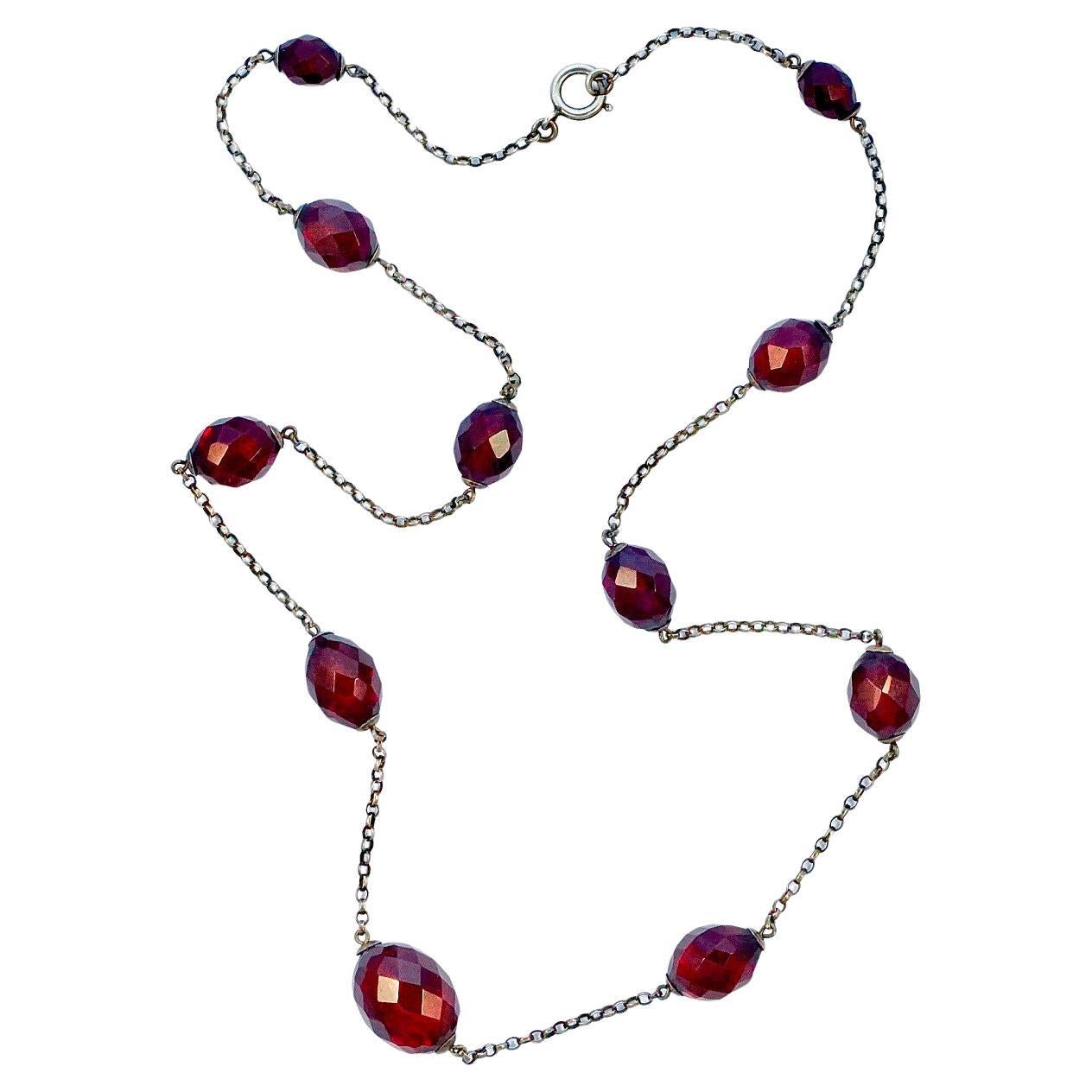 Cherry Red Bakelite Graduated Faceted Bead Necklace on Sterling Silver Chain For Sale