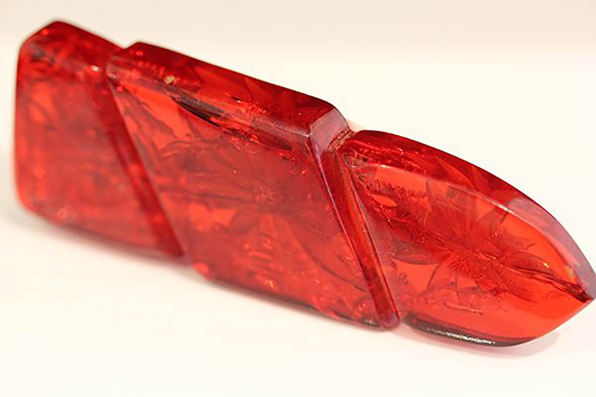 Art Deco Cherry Red, carved Bakelite brooch with Fern, C1930's For Sale