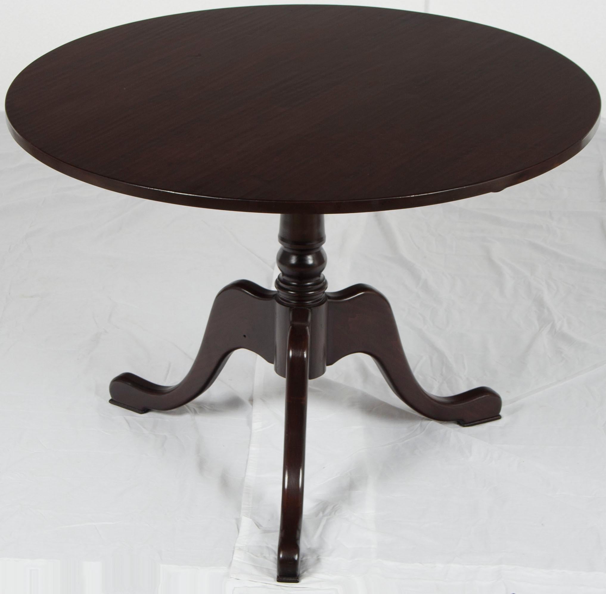 This English-made traditional style round tilt-top table provides a unique solution for tables in tight spaces. At only 42? in diameter it creates a table surface perfect for many functions. When not in use, the top can tilt up and the table can