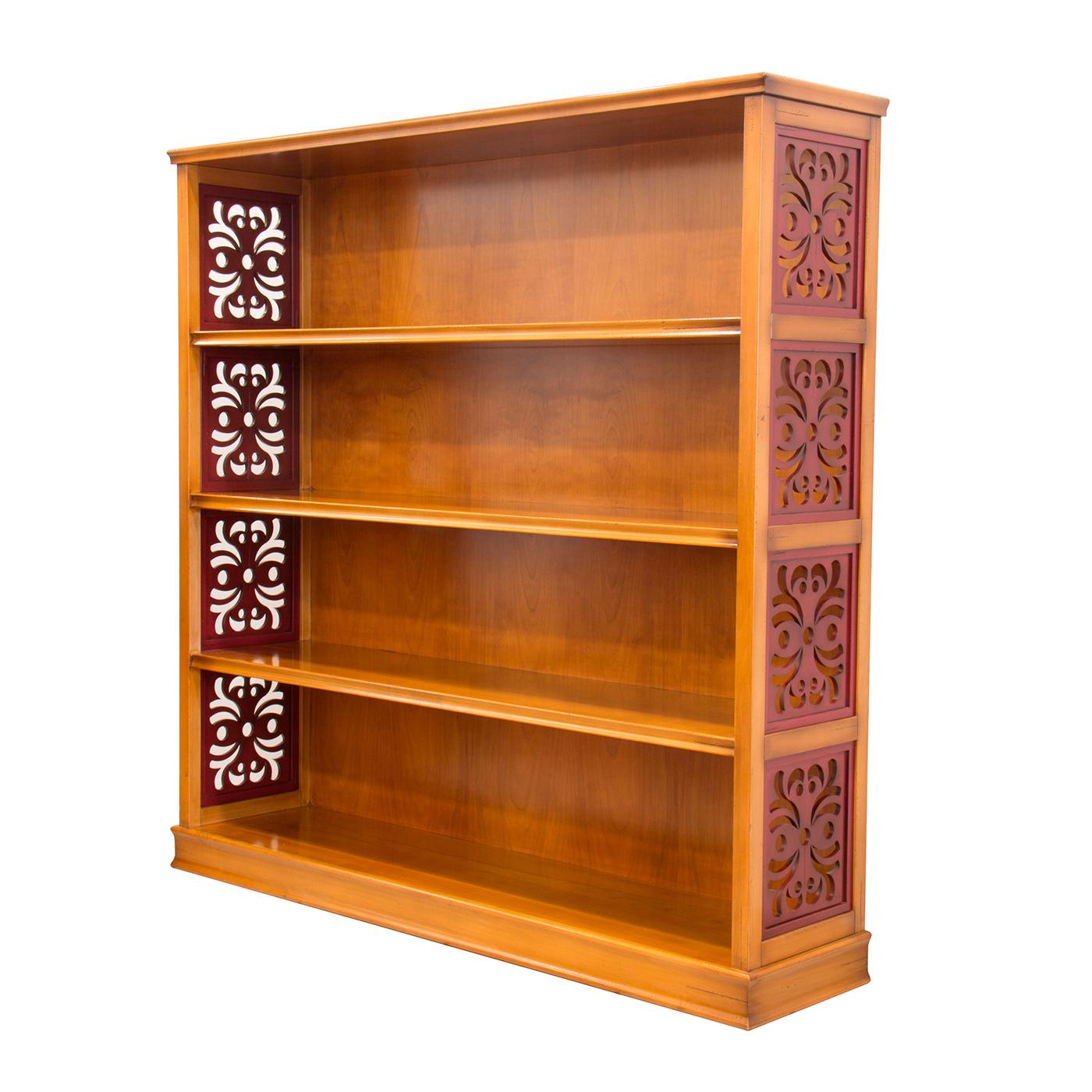 A stunning piece of functional decor, this bookcase will be a sophisticated addition to a living room or studio, showcasing books and prized objets d'art. Entirely crafted of cherry wood, it features four shelves and boasts splendid decorative inlay