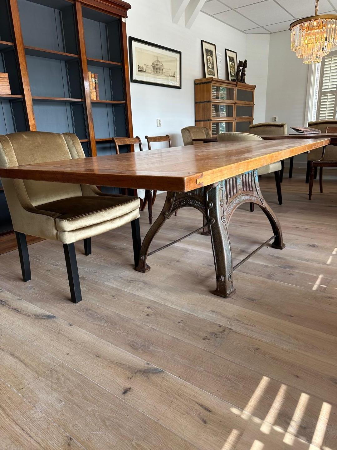 British Cherry wood table on old cast iron base For Sale