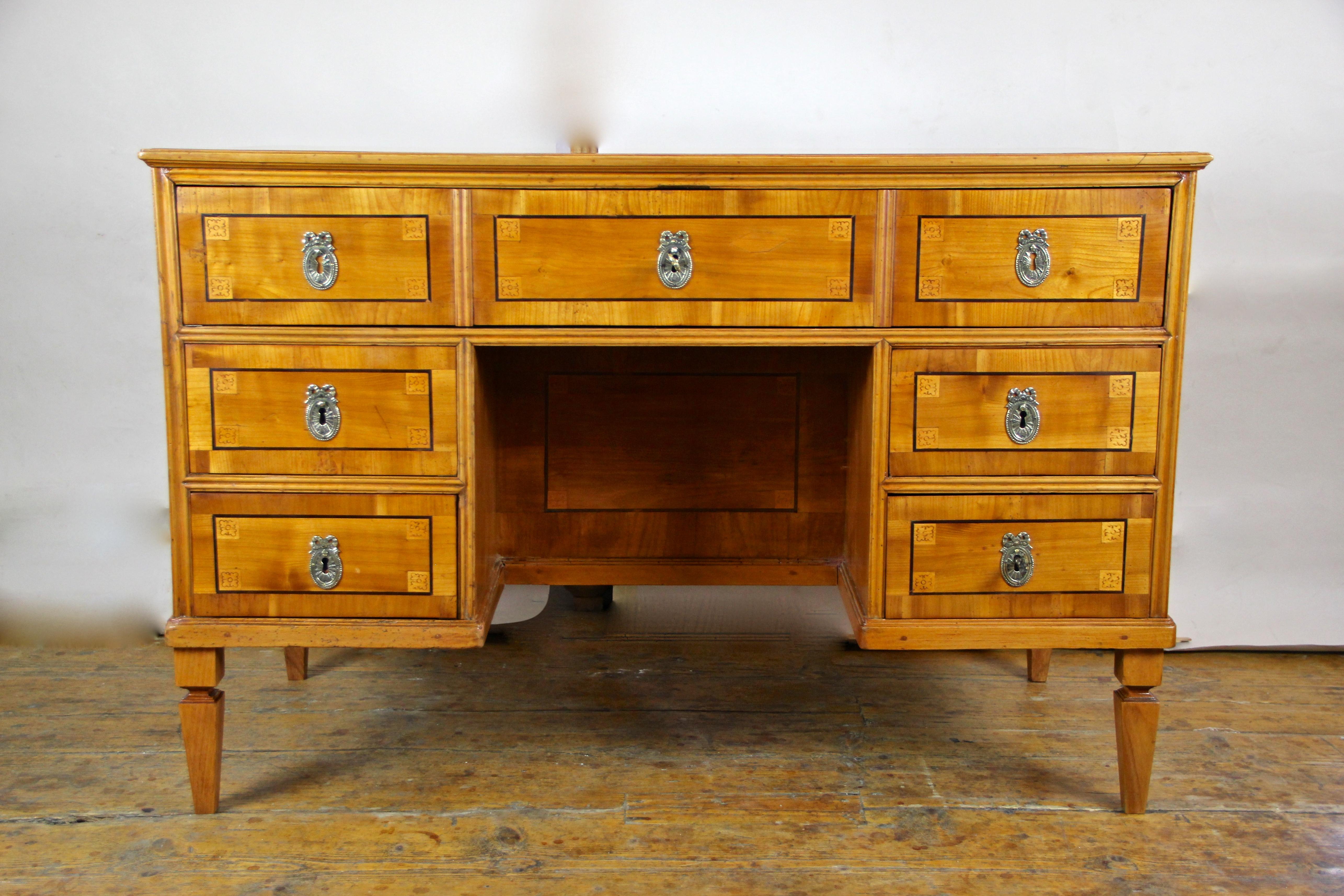 Splendid cherrywood writing desk with kneehole from the late 18th century in Austria, circa 1790. This over 220 year old writing desk from the so-called 