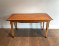 Cherrywood Coffee Table with Brass Sabots Attributed toJacques Adnet. Circa 1940