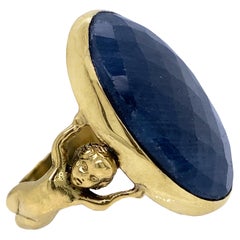 Retro Cherub Figural Solitaire Ring with Rose Cut Sapphire in 18 Karat Yellow Gold